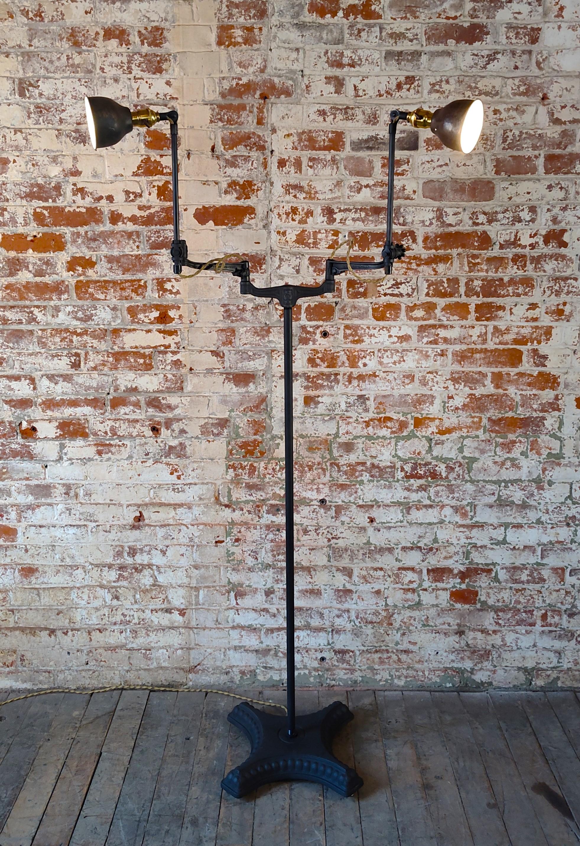 Cast Vintage Industrial Double Arm Articulating Floor Lamp with Solid Base For Sale