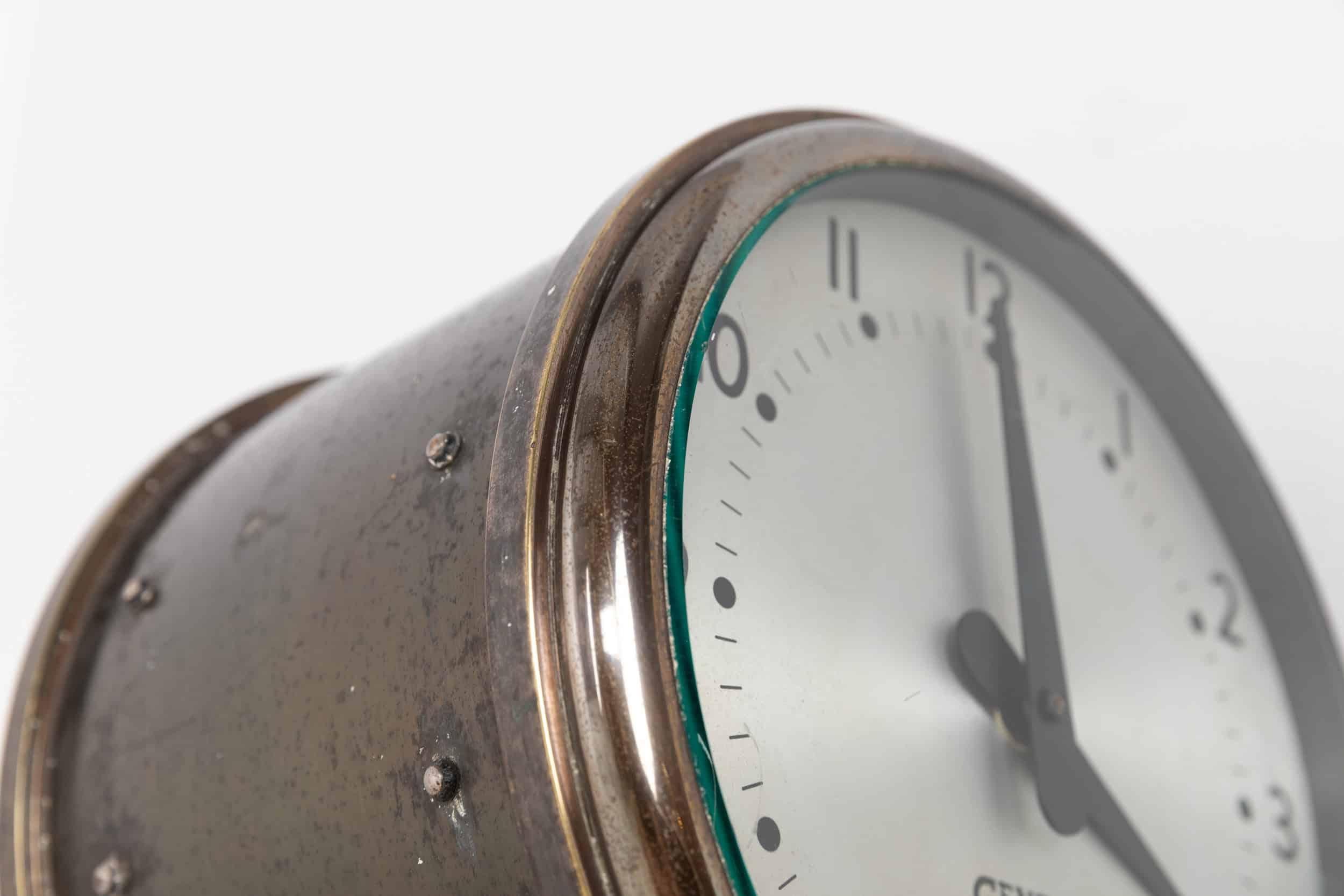 

A rare double-sided wall mounted industrial clock by Gents of Leicester. c.1940

Diminutive silvered dials set in a heavy duty, high quality brass housing supported by wall bracket. The original tapered hands are running on high torque Quartz
