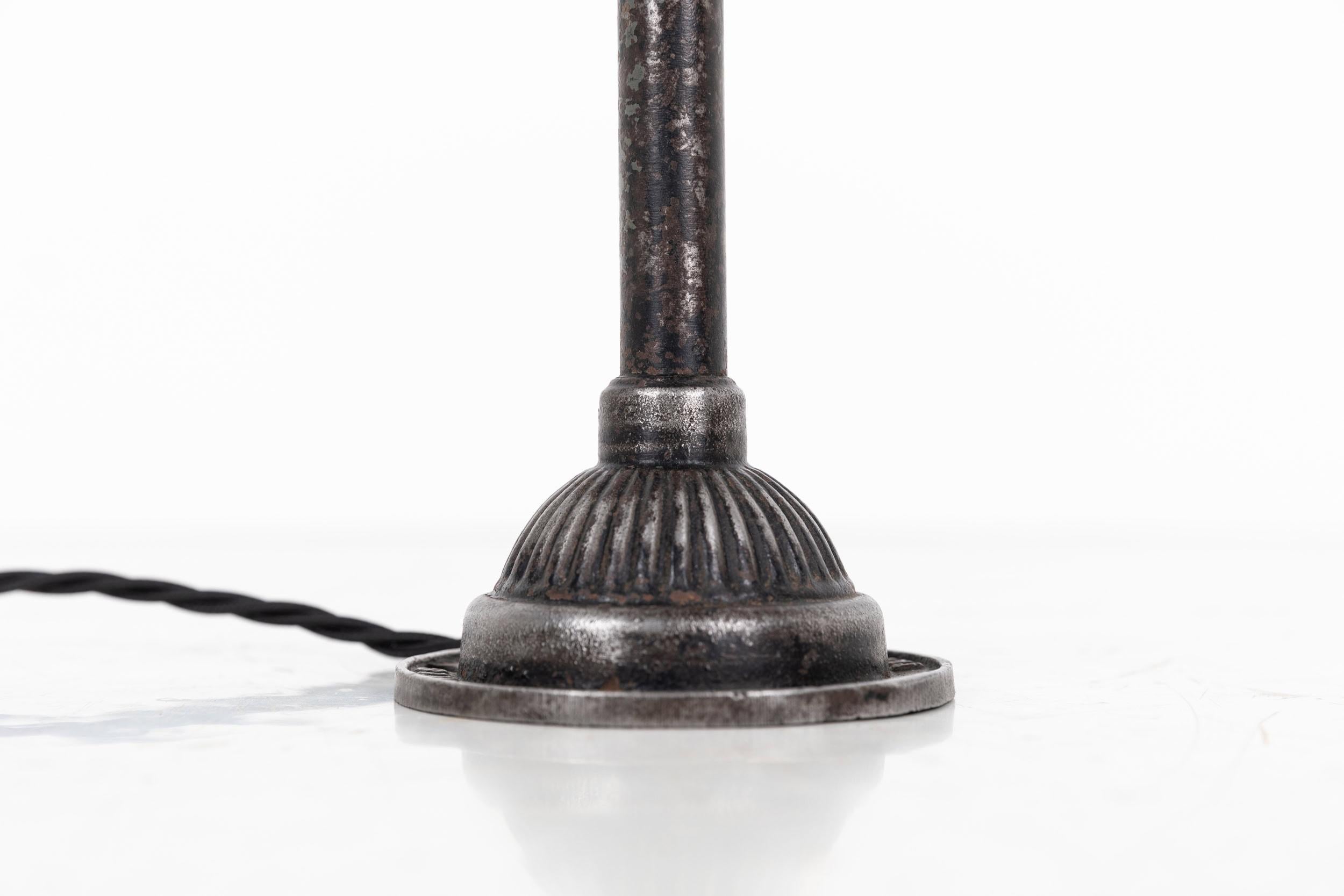 

Beautifully engineered workman's lamp designed by renowned lighting manufactures Dugdills. c.1930

In un-touched, original condition - the lamp retains remnants of its factory paint throughout and shell shade. Great articulating motion makes this