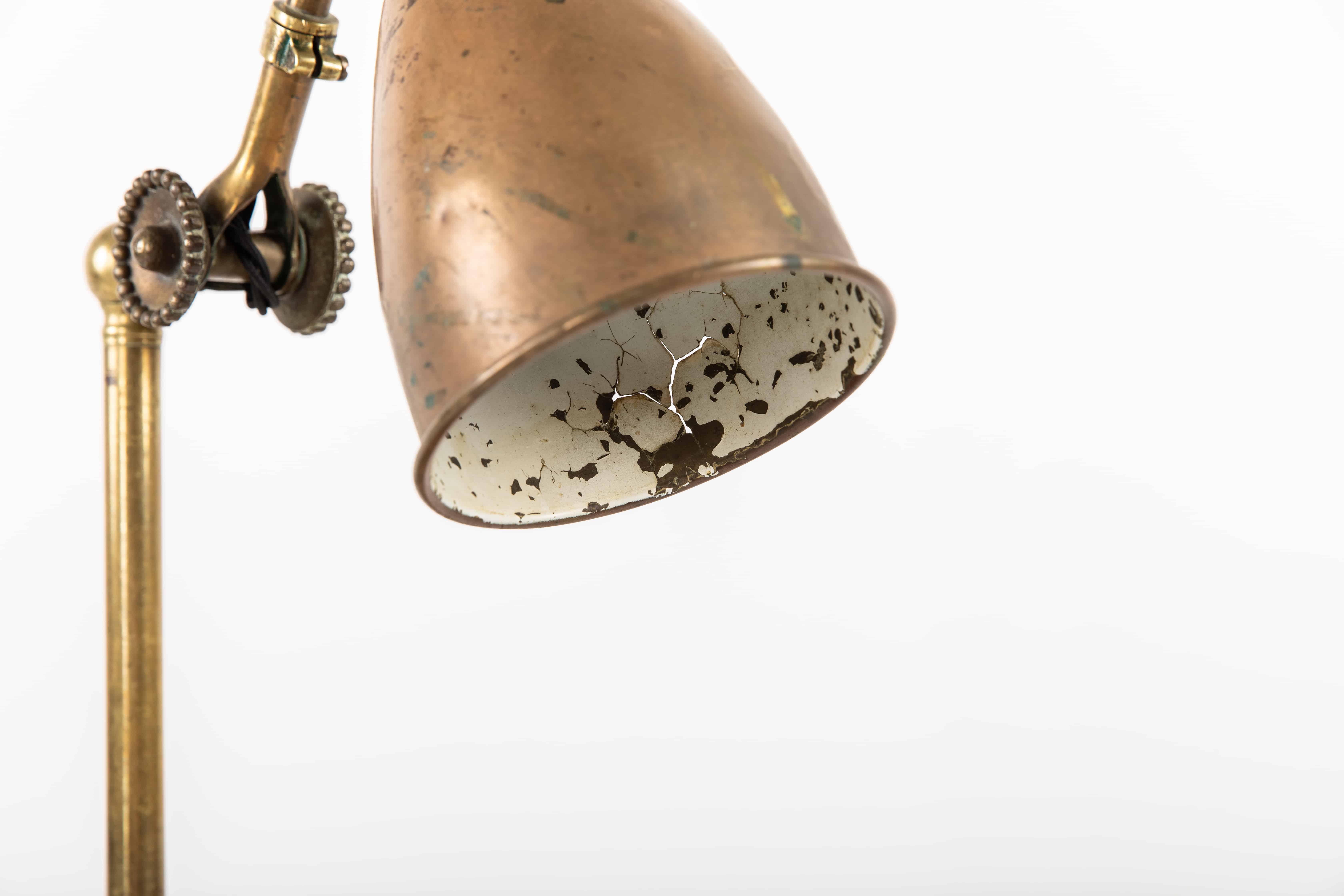 A stunning desk lamp by renowned English lighting company Dugdills. c.1920

This very early example, made entirely of brass, features the earlier 'rosettes' or daisy wheels for adjusting and tightening the joints into position and unusual heavy