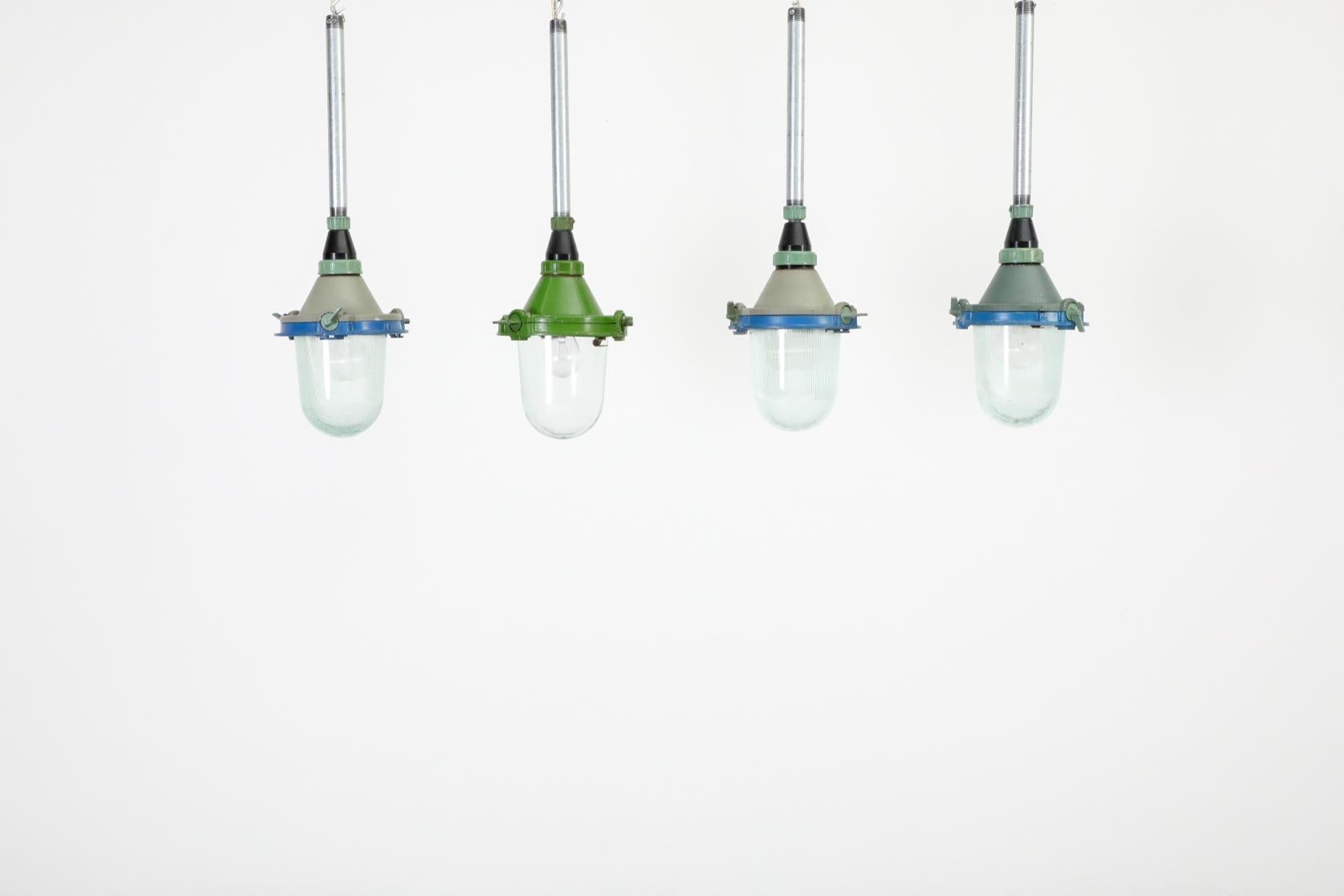 Vintage Industrial Enameled Metal Factory Lamps w/ Glass Shades and Steel Stems In Good Condition For Sale In Los Angeles, CA
