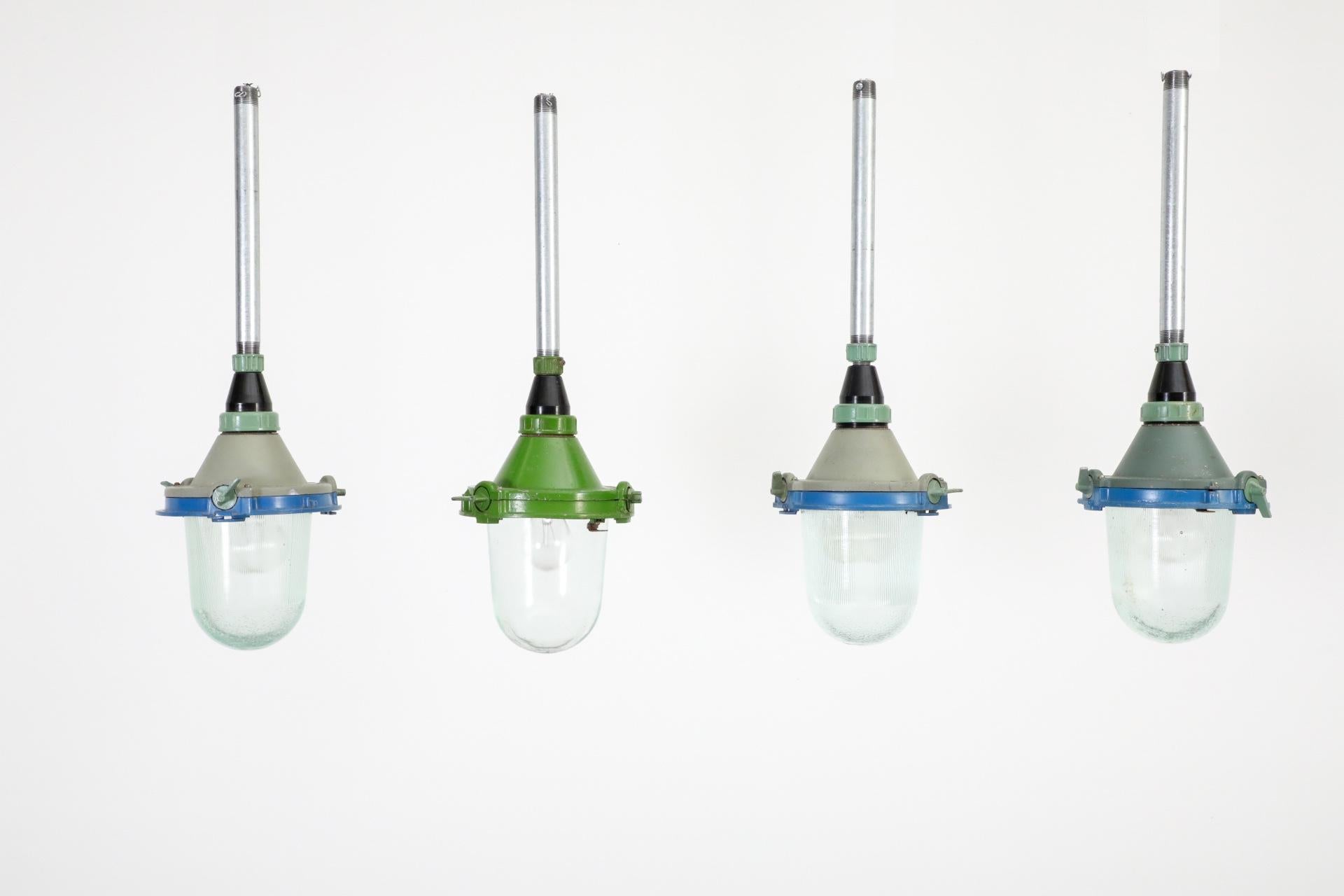 20th Century Vintage Industrial Enameled Metal Factory Lamps w/ Glass Shades and Steel Stems For Sale