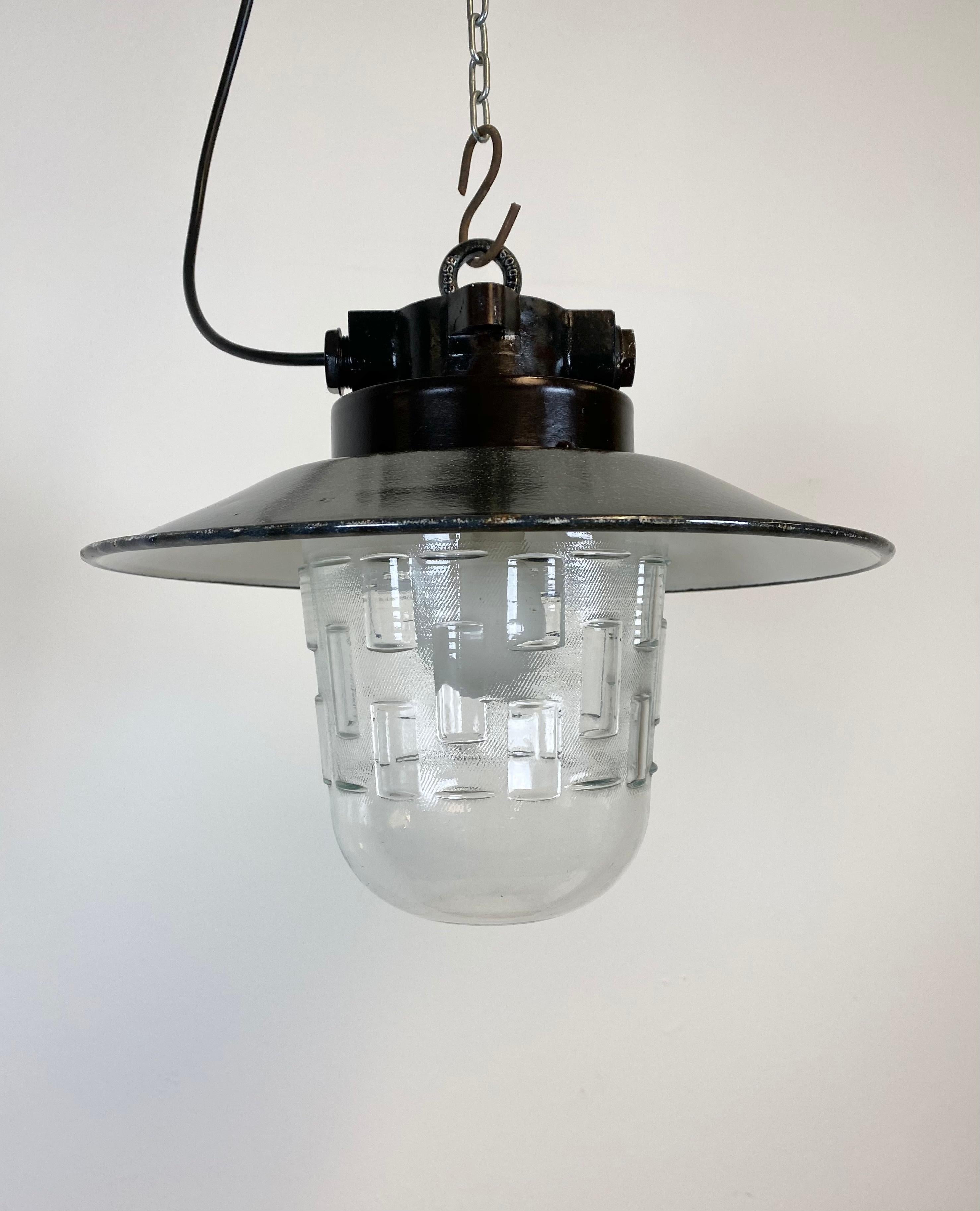 Vintage Industrial lamp from 1970s. Bakelite top. Grey enamel iron shade with white interior. Clear glass. Porcelain socket requires E 27 lightbulbs. Newly wired. The weight of the lamp is 2 kg. The diameter of the shade is 34 cm.