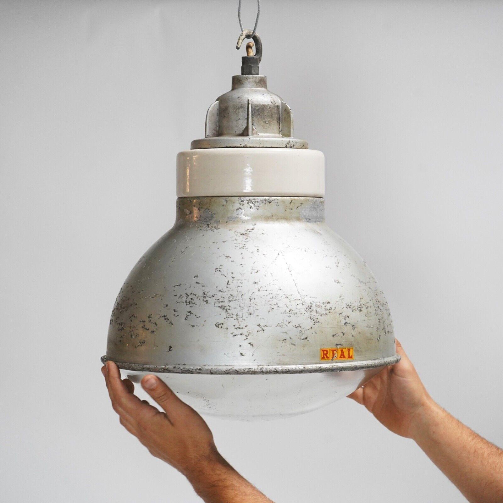 We have 1 original industrial factory pendant Reflector light left. Made by British maker Simplex, each has a brushed aluminium cutter casing, and porcelain & aluminium upper gallery. They all have a lovely REAL stamp in video red and yellow and