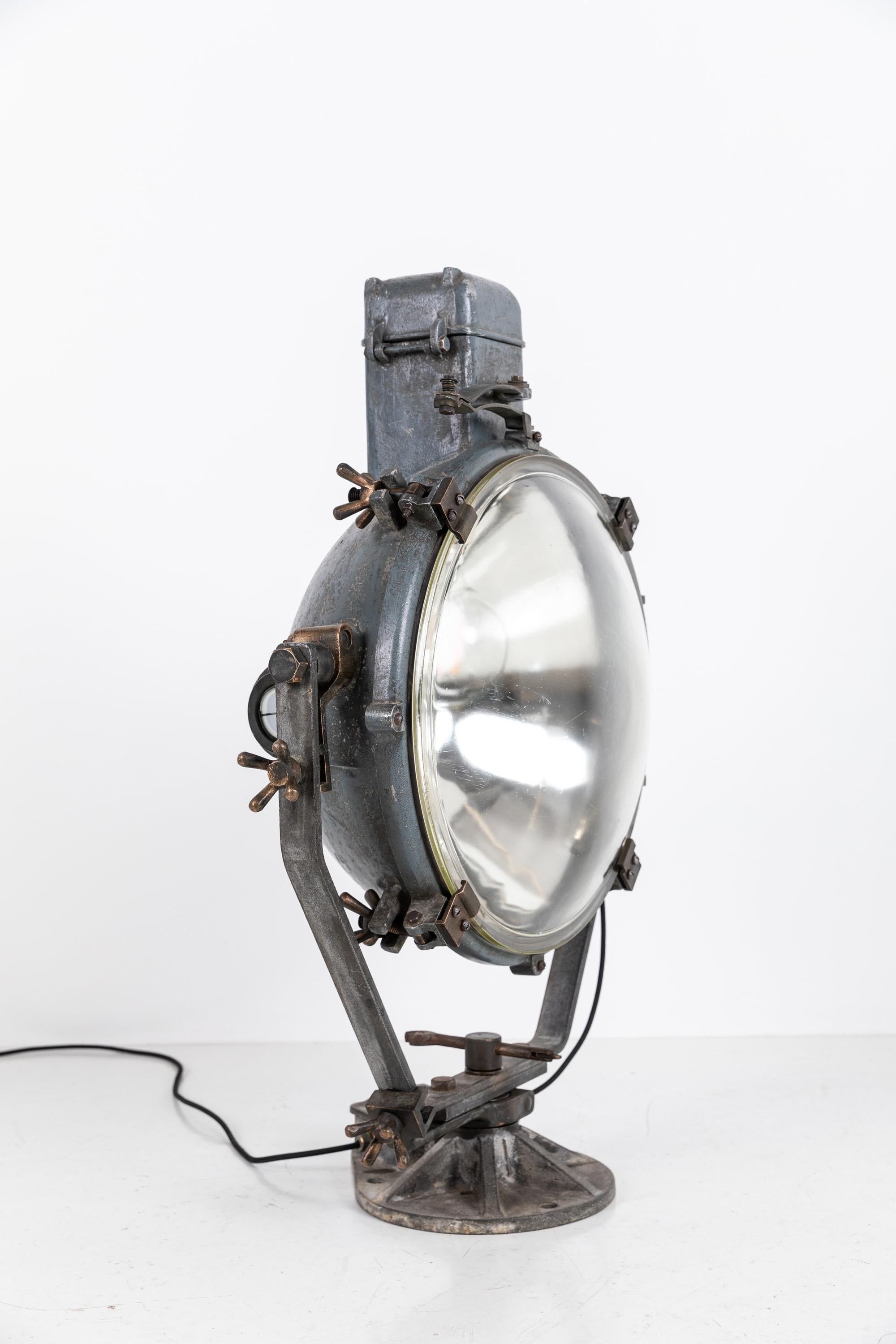 A quality and rare example of a large WWII era ships search light by 20th century electrical manufactures GEC- General Electric Company. c.1940

An incredible piece of engineering, comprising of heavy cast metal with detailed bronze hardware and