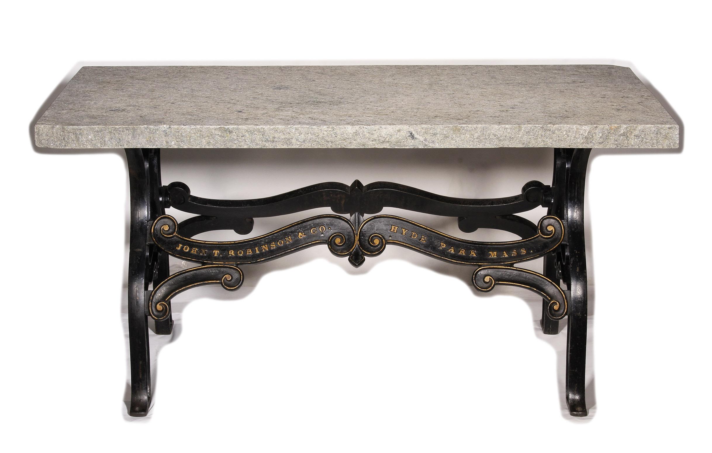 Beautiful cast iron base from an old printing factory in original condition, showing detailed artwork topped with a piece of Vermont granite.