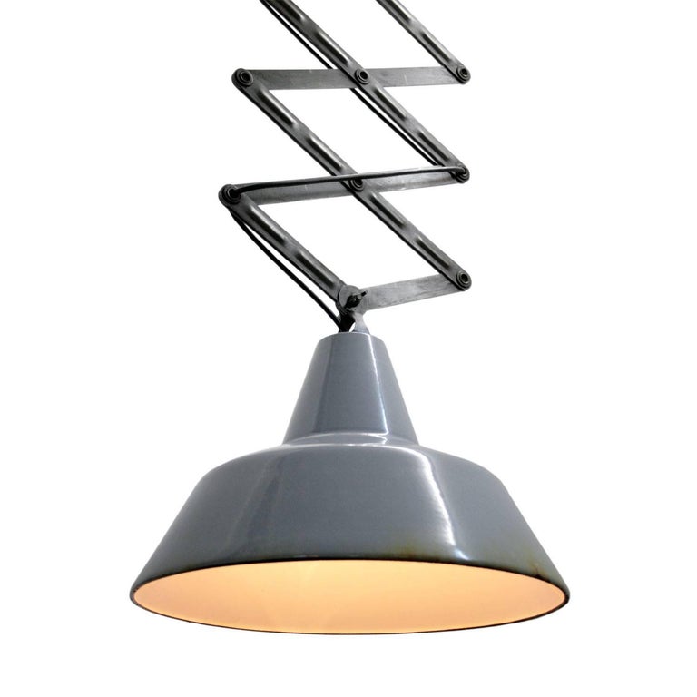 Scissor varia steel pendant. Grey enamel. White interior. Mounting plate: 12 × 7 cm.

Weight: 5.8 kg / 12.8 lb

Priced per individual item. All lamps have been made suitable by international standards for incandescent light bulbs,