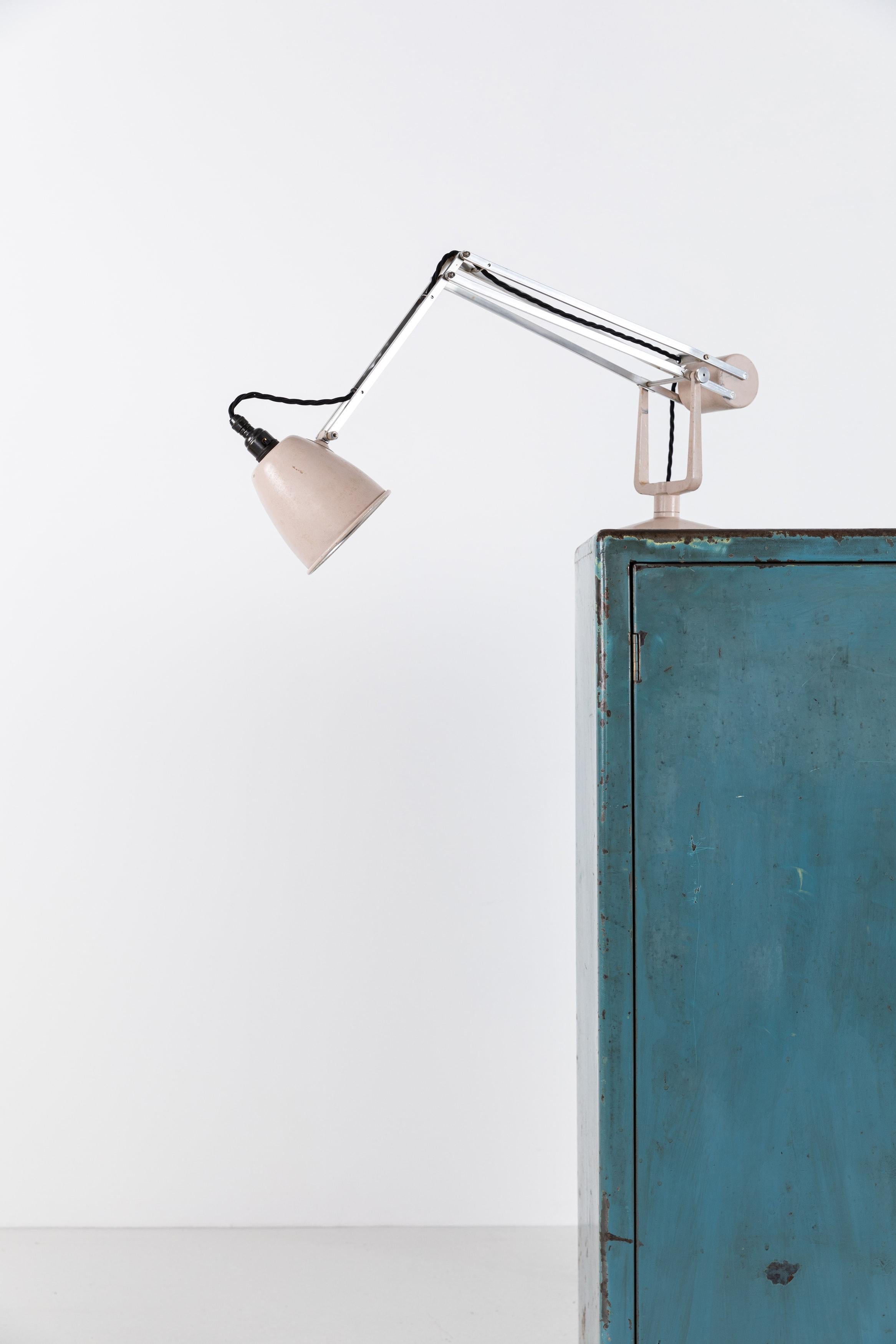 Stunning example of the iconic counterbalance 'Roller' lamp, ingeniously designed by Hadrill & Horstmann. c.1940

This lamp has survived in wonderful condition - bare aluminium arms with cream base and shade. The elegant weighted system allows the
