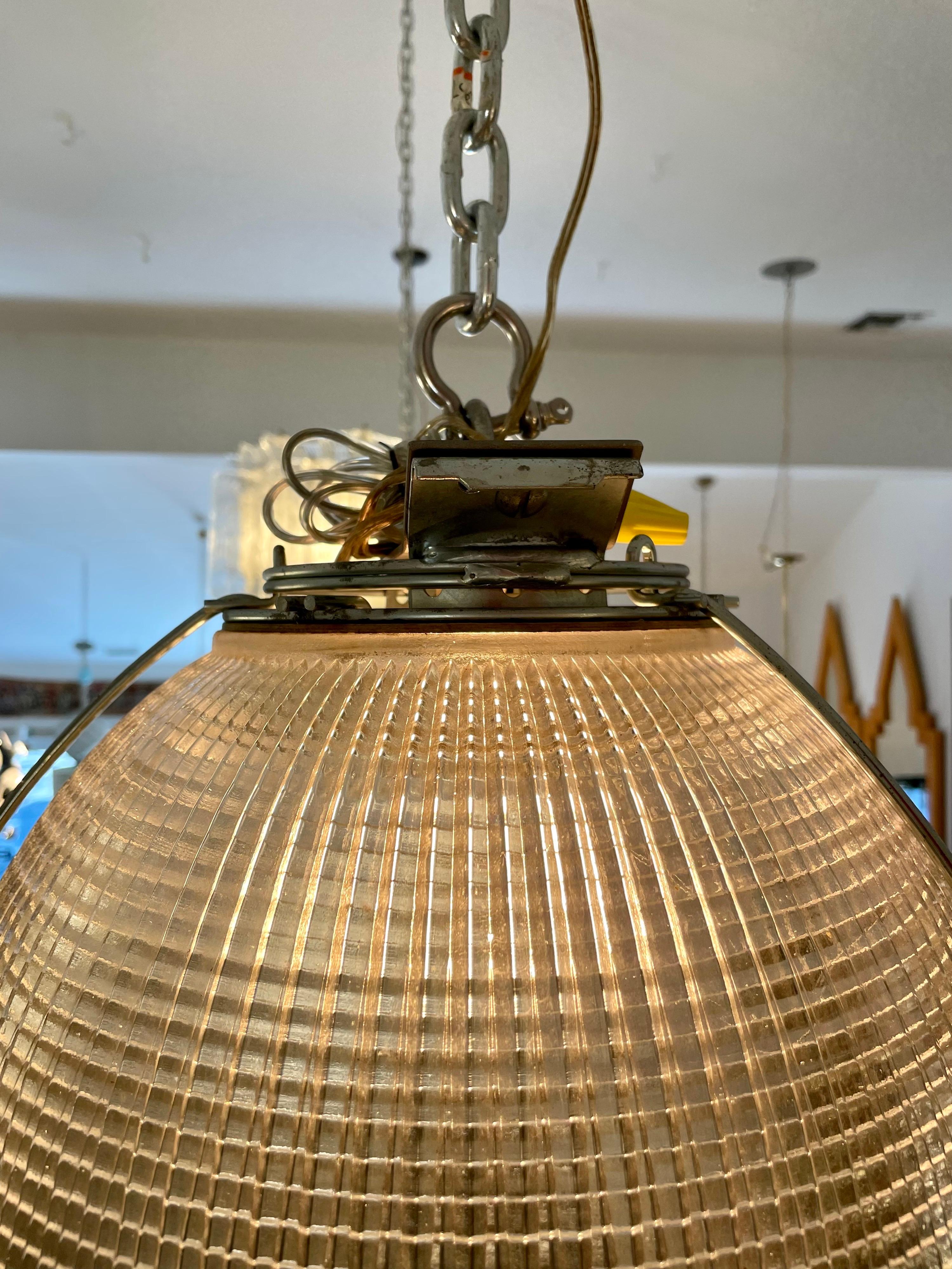 This wonderfully industrial domed hanging light made from molded glass with a beautiful faceted design (see detail images). a chain of 24 inches included but more can be added by your electrician/ installer. It is rewired and ready to hang.