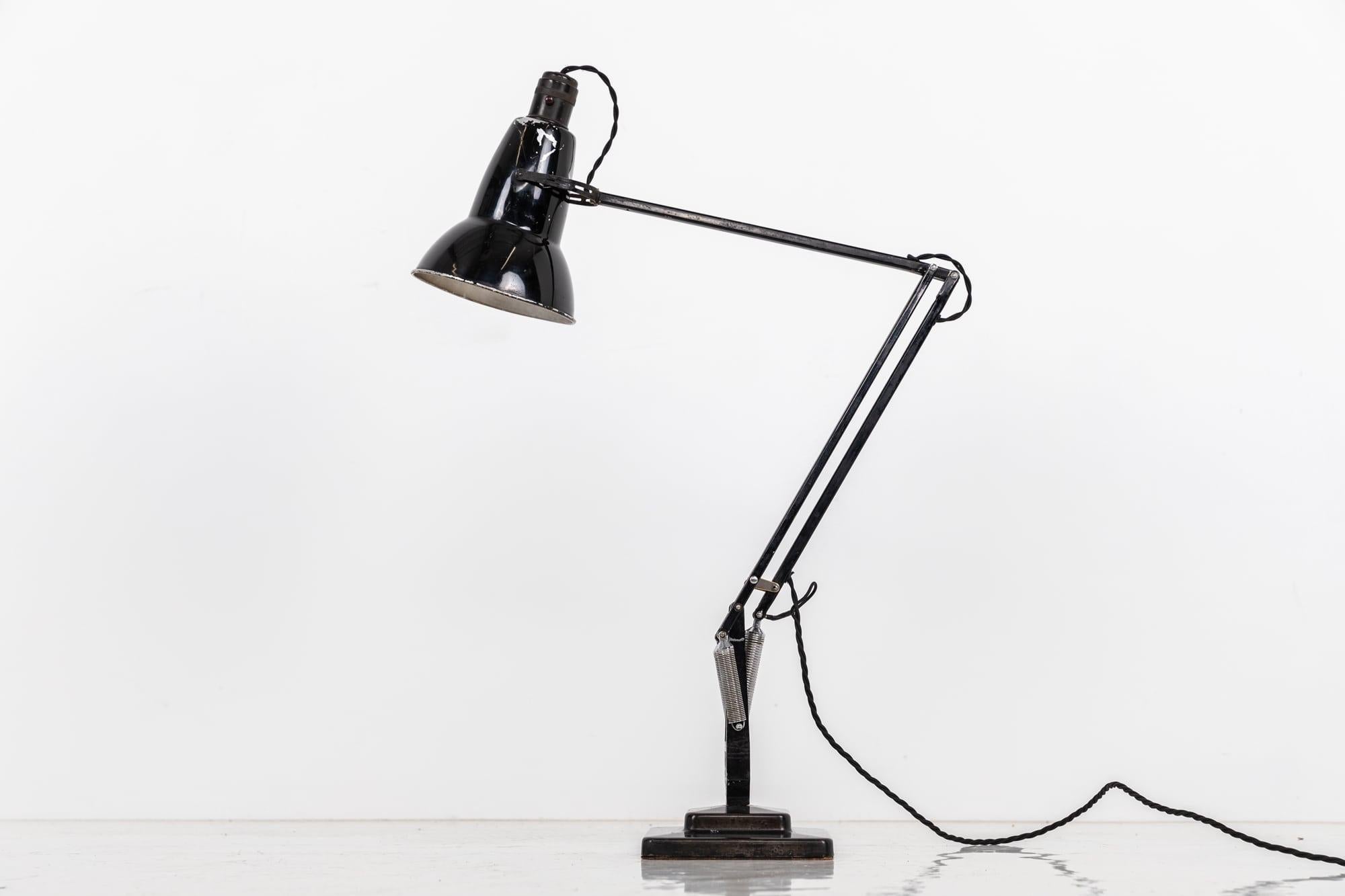 

Iconic angelpoise lamp made by Herbert Terry & Sons. c.1940

One of the most famous desk lamps in british industrial history and still made to this day. In fully original condition including the Bakelite Crabtree switch.

Rewired with 2m of black