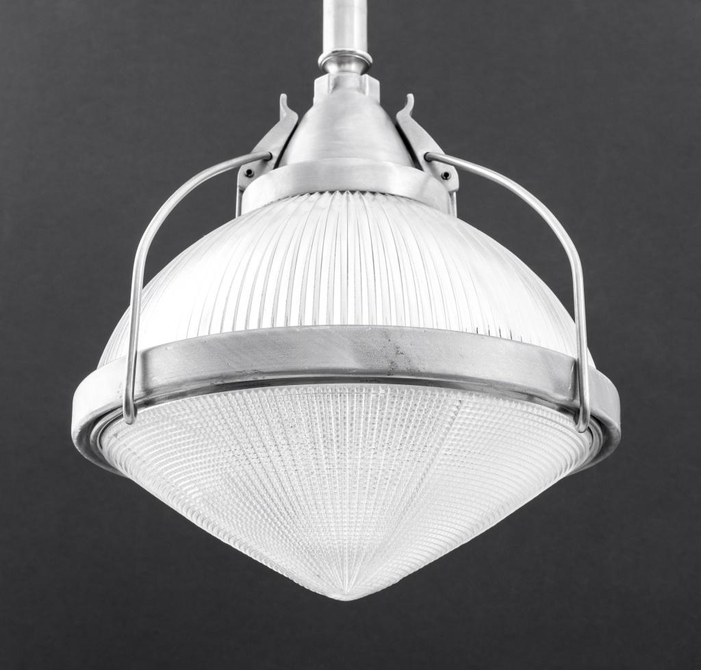 Vintage Industrialist Holophane Hanging Ceiling Pendant Lamp, the glass shade with ribbed textured surface and suspended from silver-tone metal mounts. Provenance: From a Rye, N.Y. collection.

Dealer: S138XX