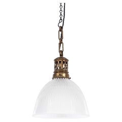 Lampe pendante industrielle vintage en verre prismatique Holophane. 1920