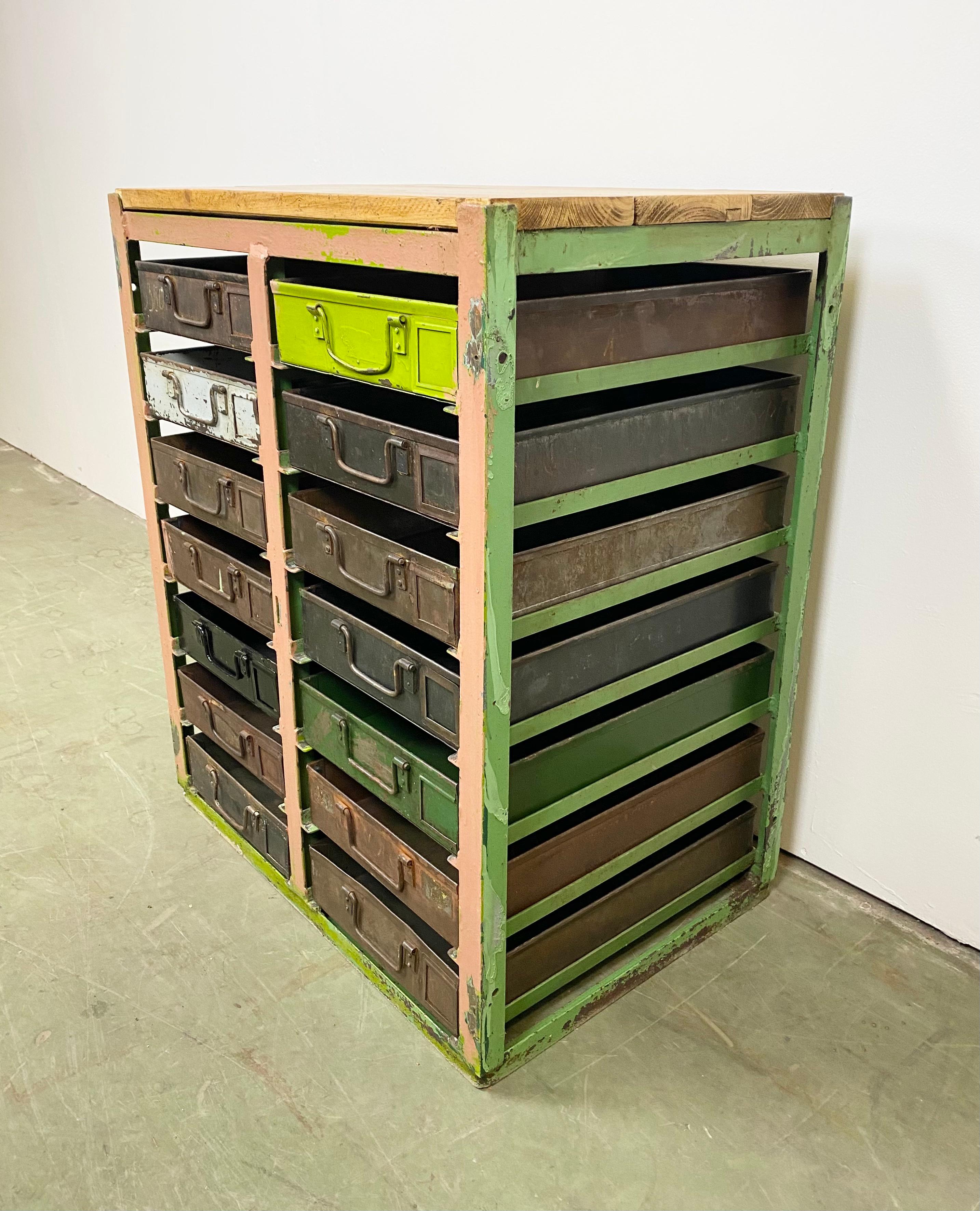 This vintage Industrial iron chest of drawers was made during the 1950s. It features an iron construction, old wooden top and 14 metal drawers. Additional dimensions:
Drawer dimensions
- Width 28 cm, depth 44 cm, height 8 cm
- Weight: 57 kg.