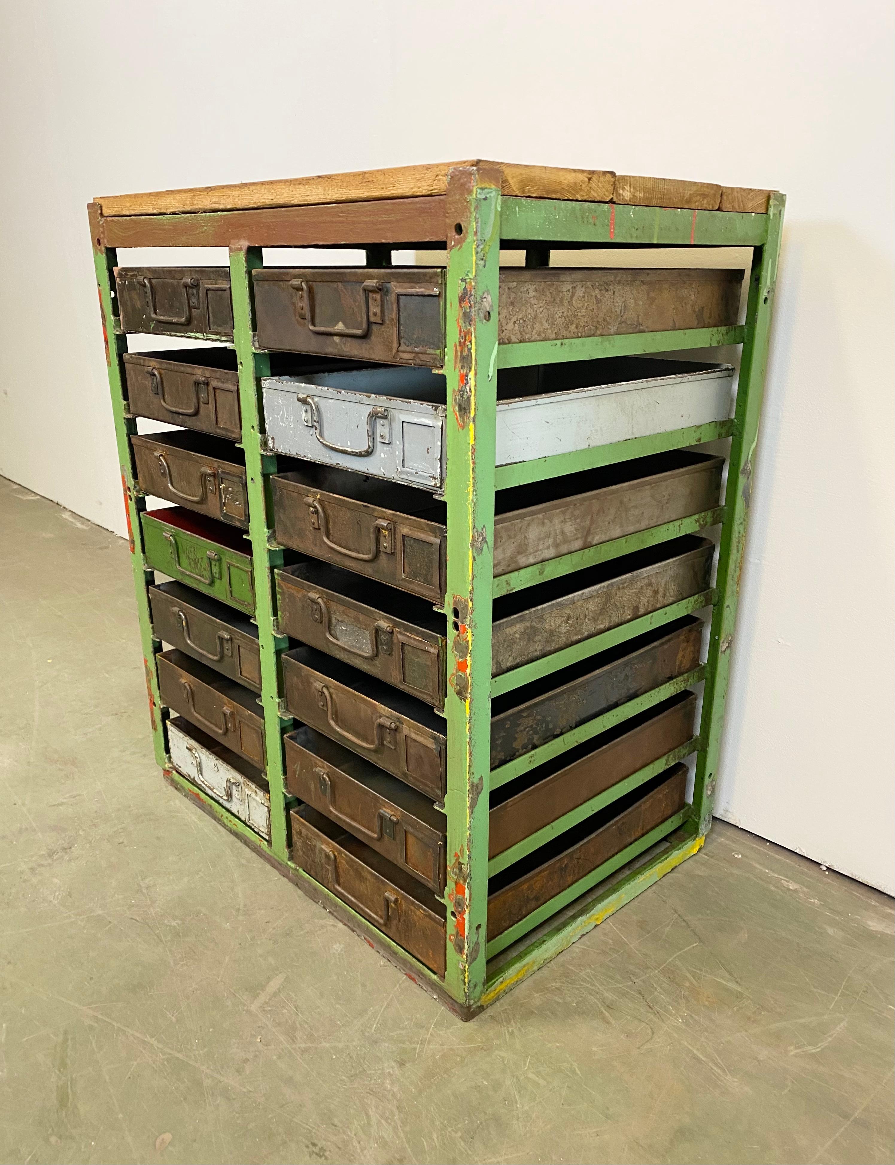 This vintage industrial iron chest of drawers was made during the 1950s. It features an iron construction, old wooden top and 14 metal drawers. Additional dimensions:
Drawer dimensions:
- Width 28 cm, depth 44 cm, height 8 cm
- Weight: 60 kg.