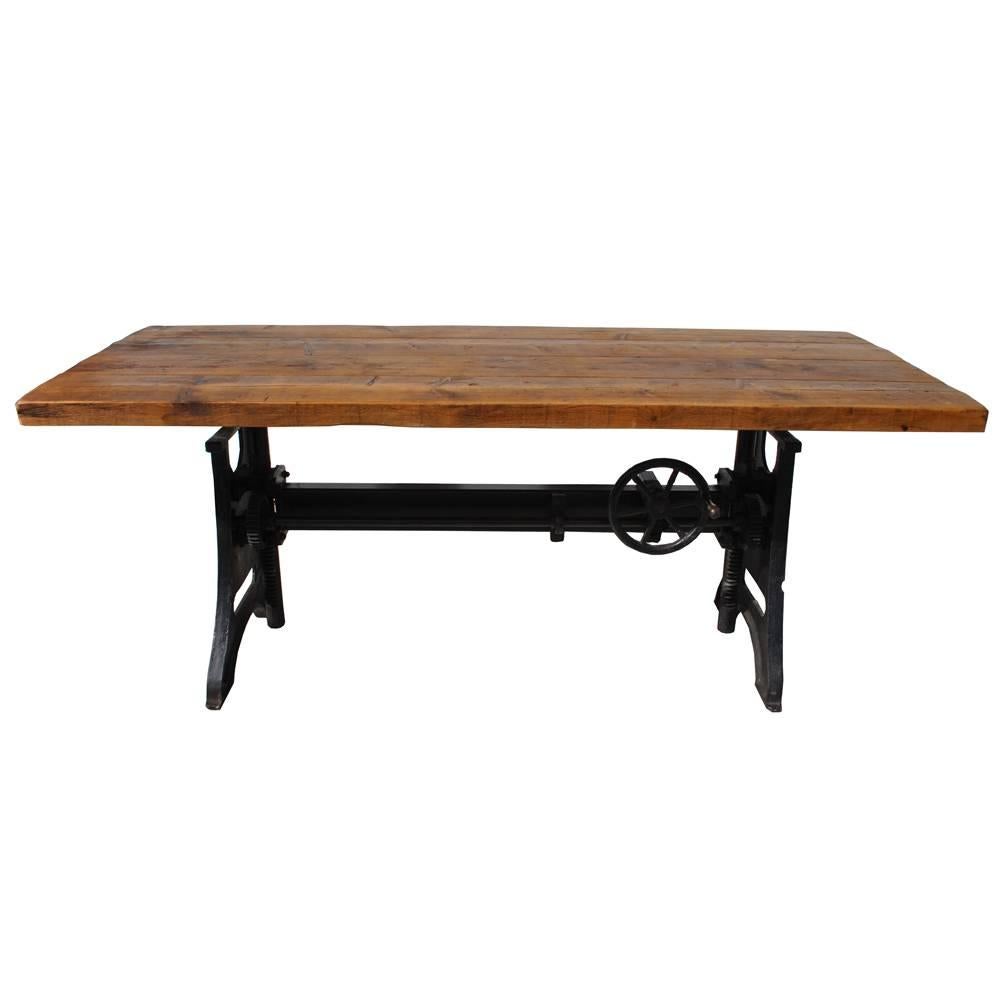  Industrial Era Style Table Desk

An adjustable cast iron base with a crank mechanism that allows height adjustment from 31-40