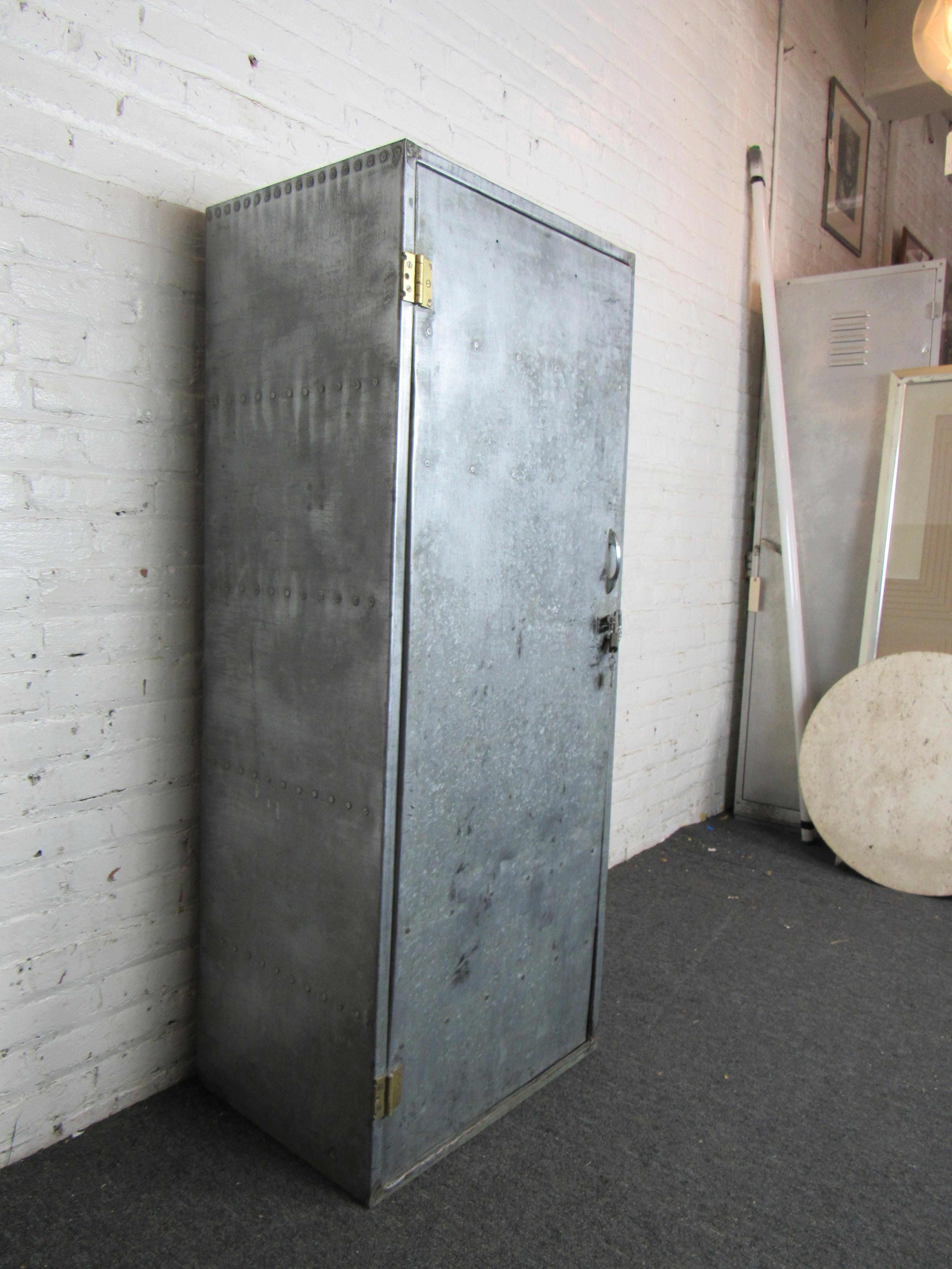 A tall metal locker with a weathered industrial look, this vintage piece is perfect for adding character and practical storage to any workshop or studio. Please confirm item location with seller (NY/NJ).