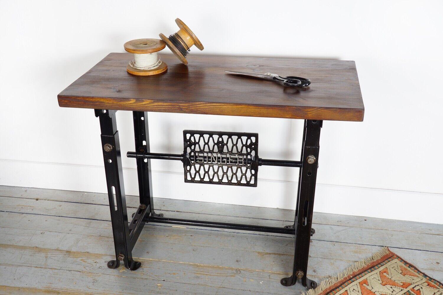 Industrial Metal Vintage Desk

This is a vintage machinist desk from the 1940s fitted with a reclaimed top. It has a metal stand that was made in Clydebank, Scotland, and features the original Singer manufacturer's stamp. 

The desk is well-weighted