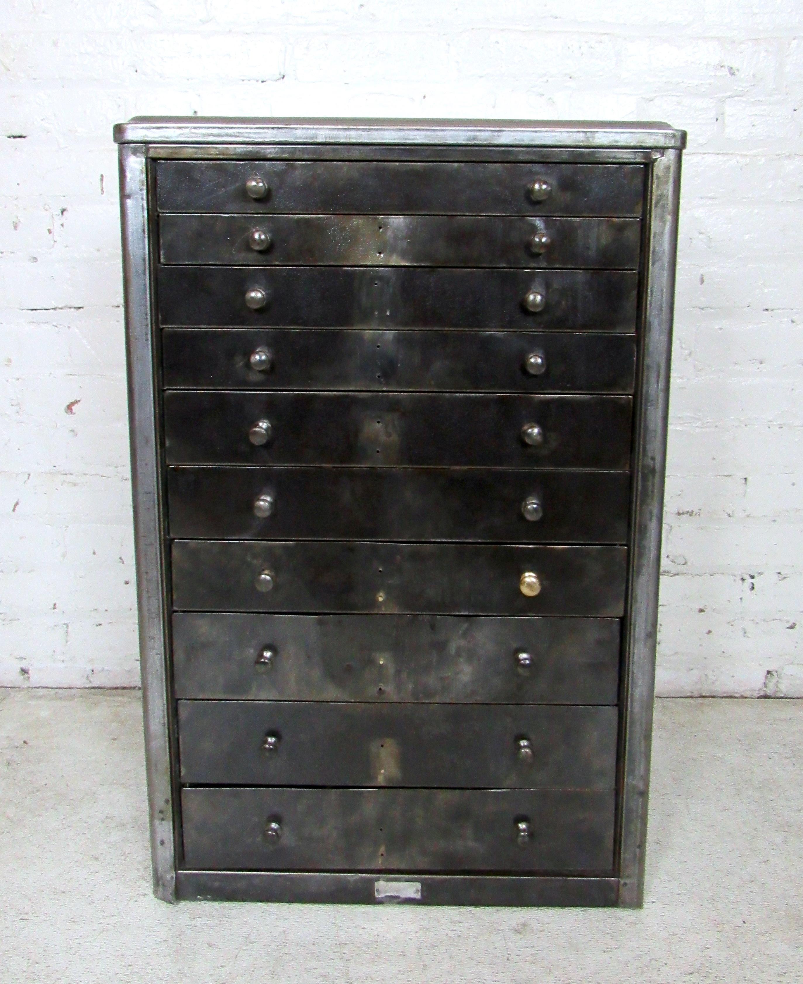 This primitive industrial metal cabinet features ten drawers from small to large in size.

Please confirm the item location (NY or NJ).