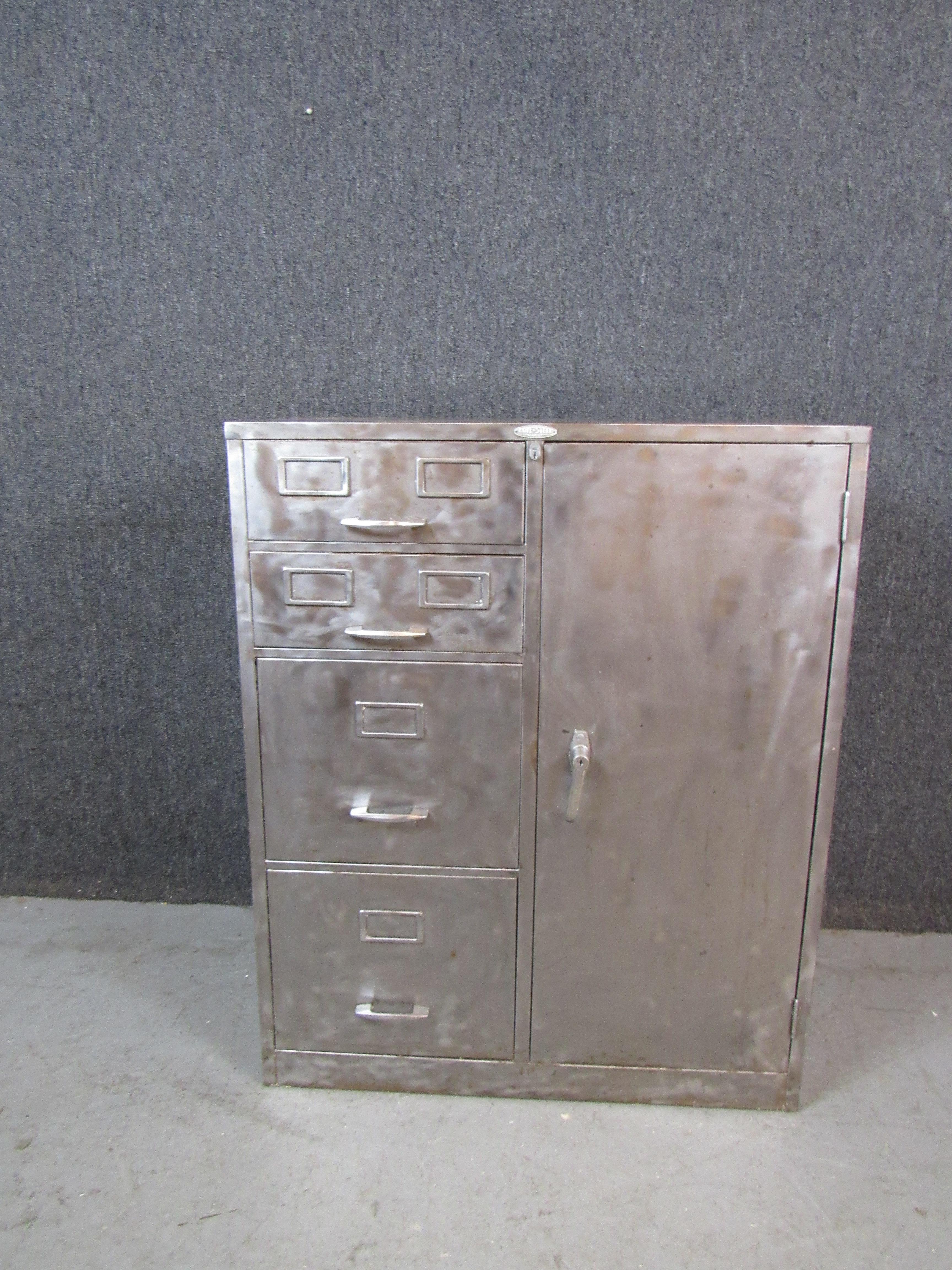 Furnish your house with genuine American-made industrial metal with this impressive cabinet from New York's Cole-Steel Equipment Co. Stripped bare of it's dull factory paint and restored to it's raw metal glory, this is an equally fashionable and