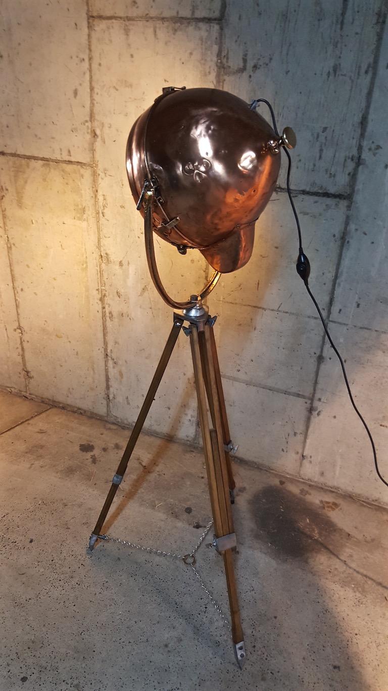 This is a beautiful, rare and unique, high end piece of lighting called a Novalux Projector by General Electric. 

This all copper light is all original. The lens is in good shape, as is the reflector inside the light. It is mounted by a solid brass