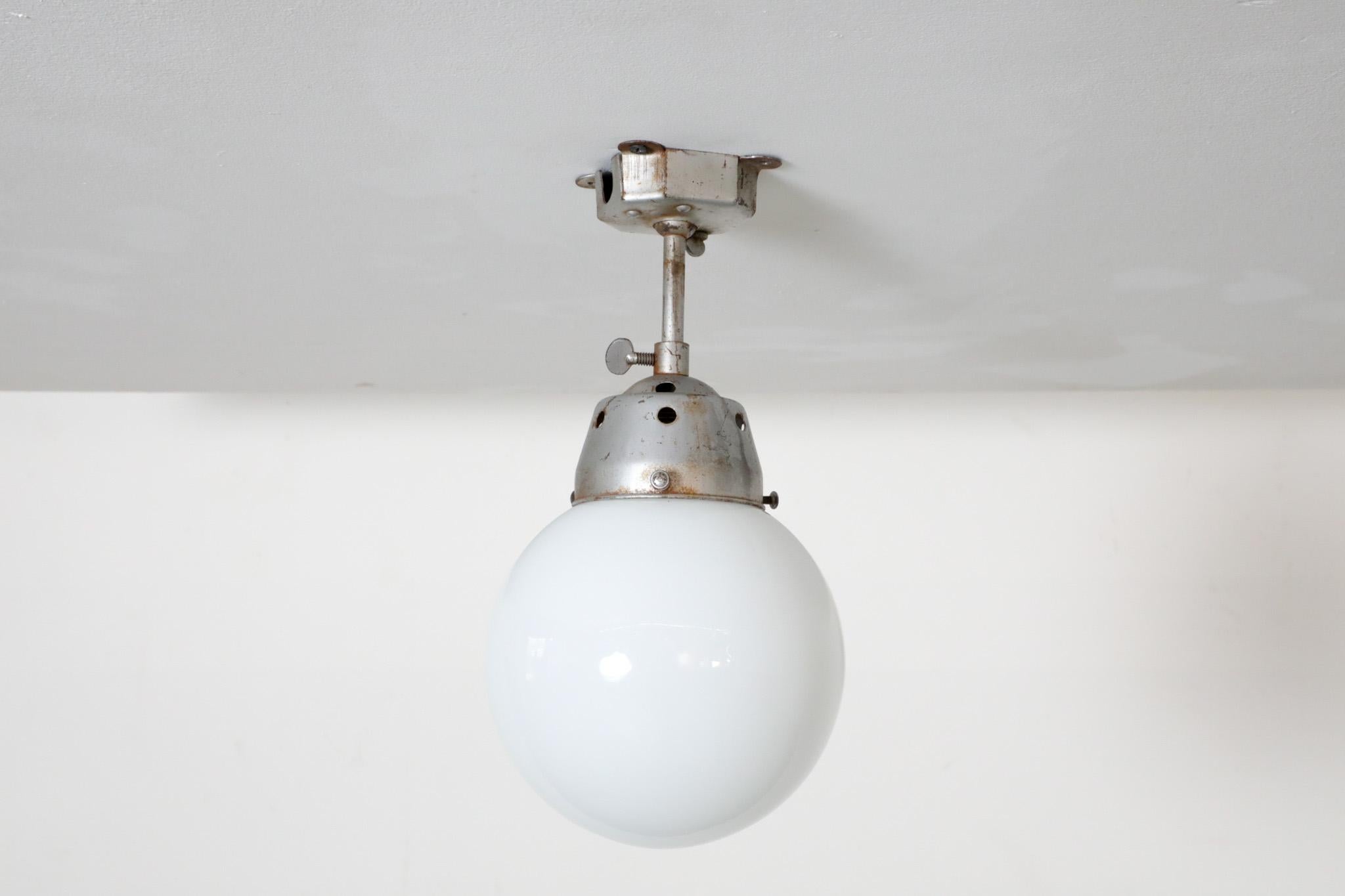 Vintage Industrial Opaline Glass Globe Light with Raw Metal Mounting For Sale 5