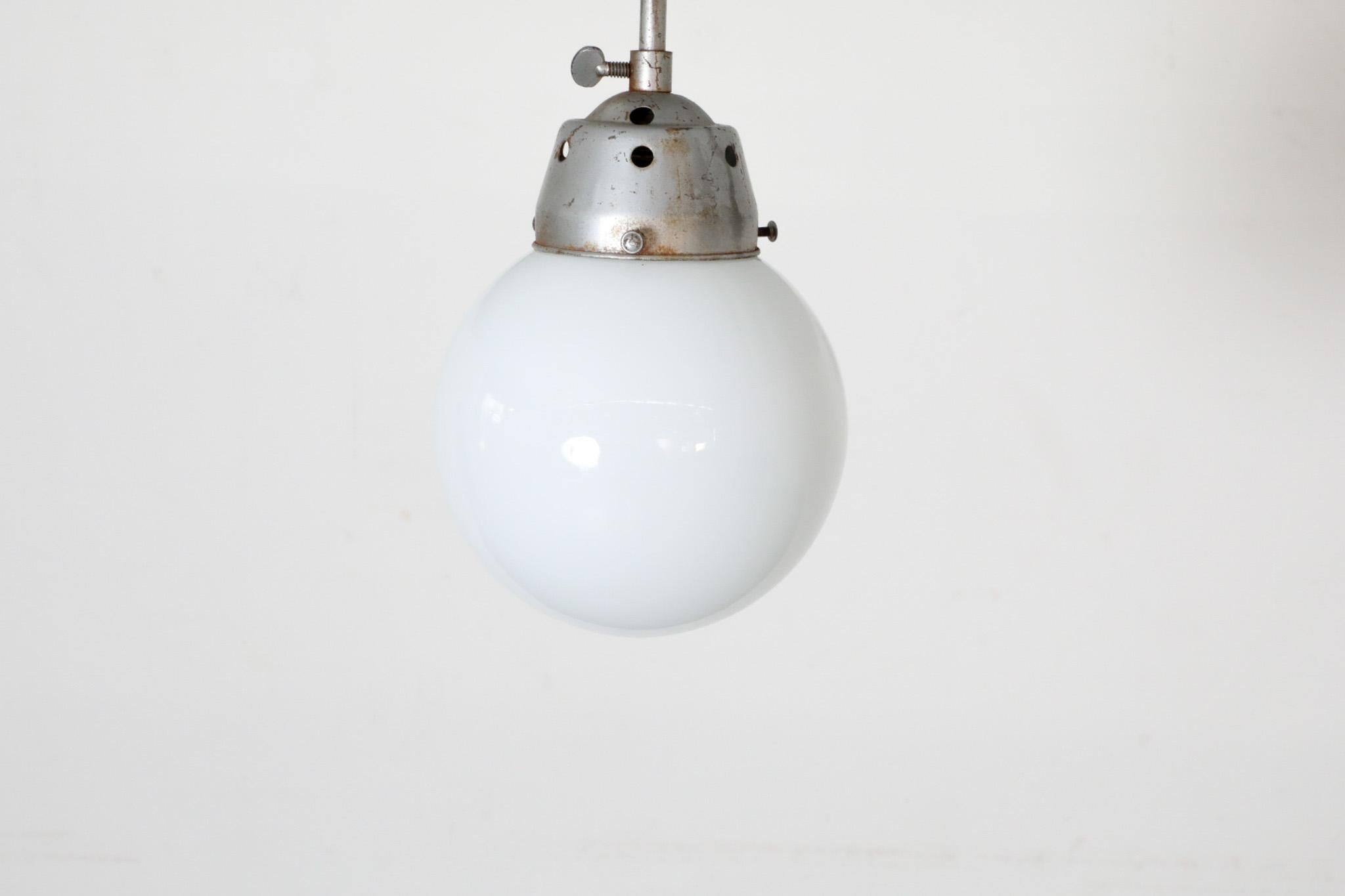 Vintage Industrial Opaline Glass Globe Light with Raw Metal Mounting For Sale 6