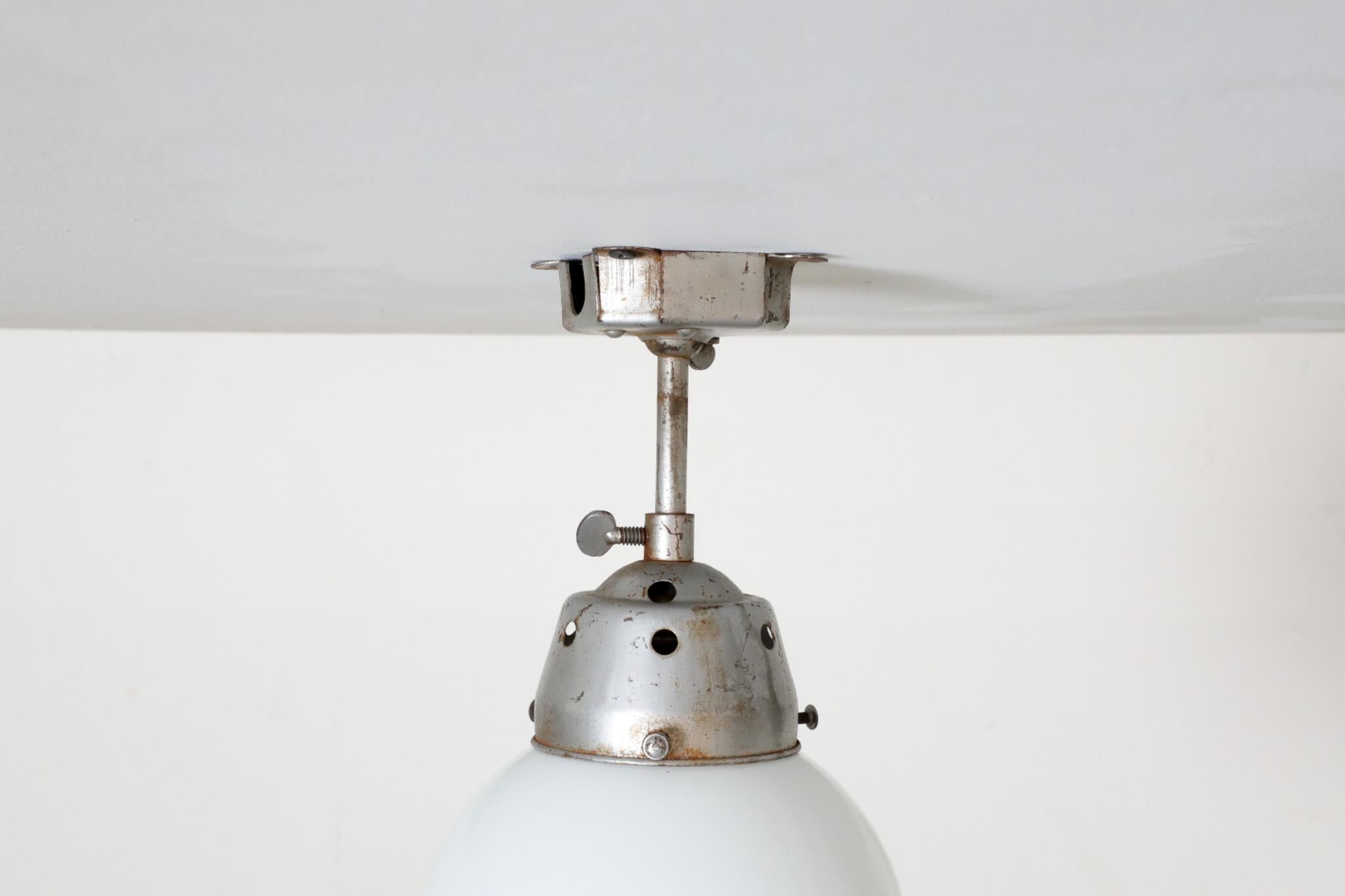 Vintage Industrial Opaline Glass Globe Light with Raw Metal Mounting For Sale 7