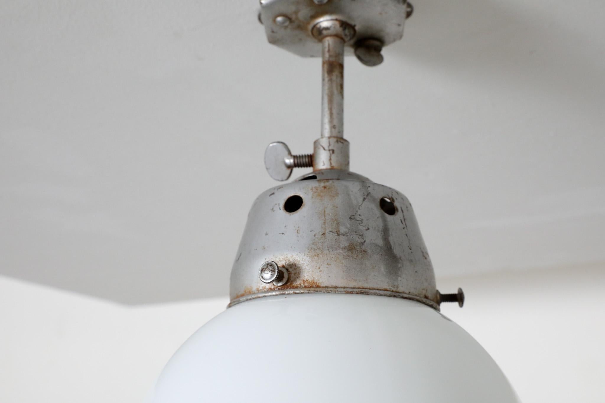 Vintage Industrial Opaline Glass Globe Light with Raw Metal Mounting For Sale 8