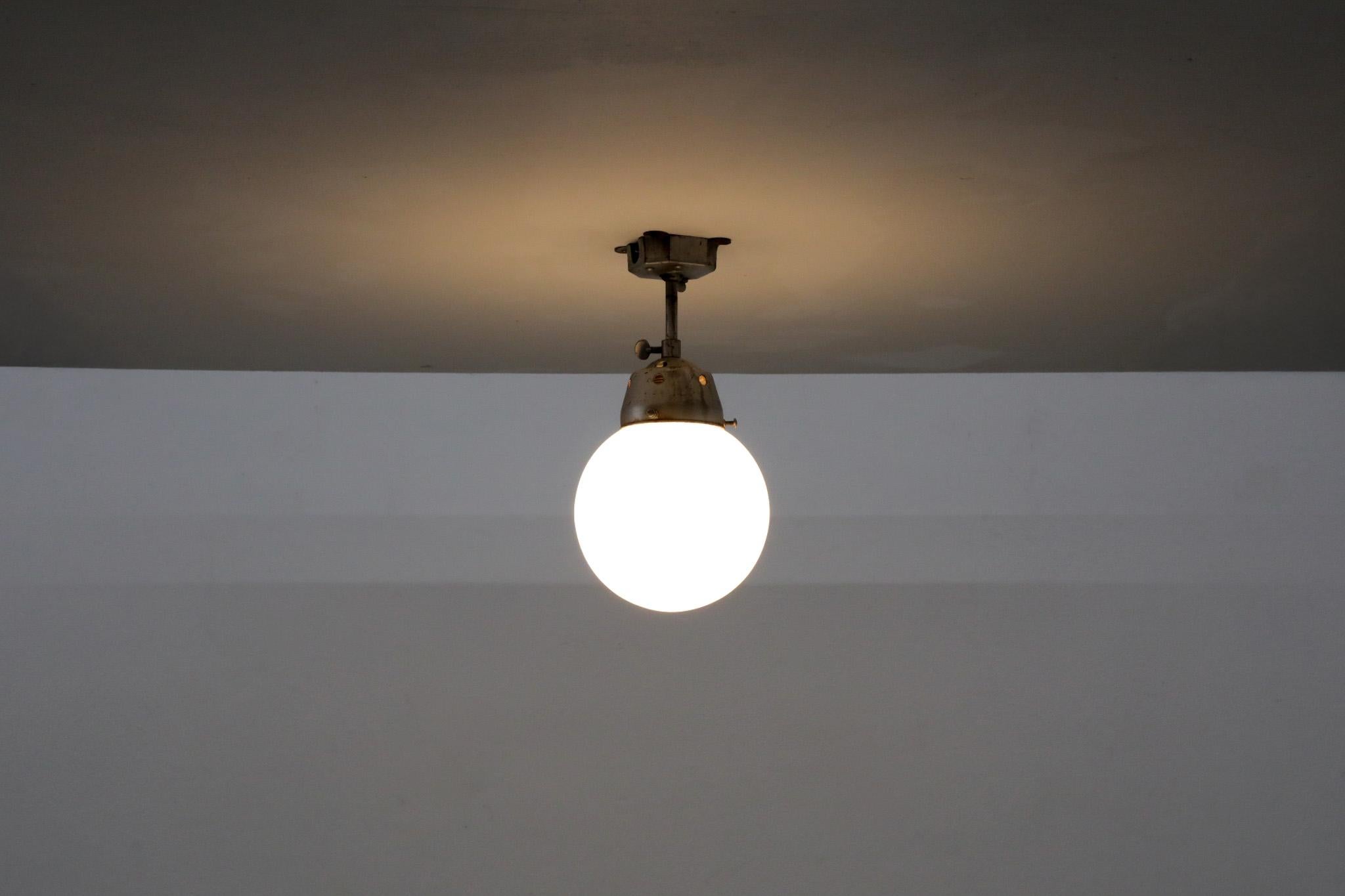 Dutch Vintage Industrial Opaline Glass Globe Light with Raw Metal Mounting For Sale