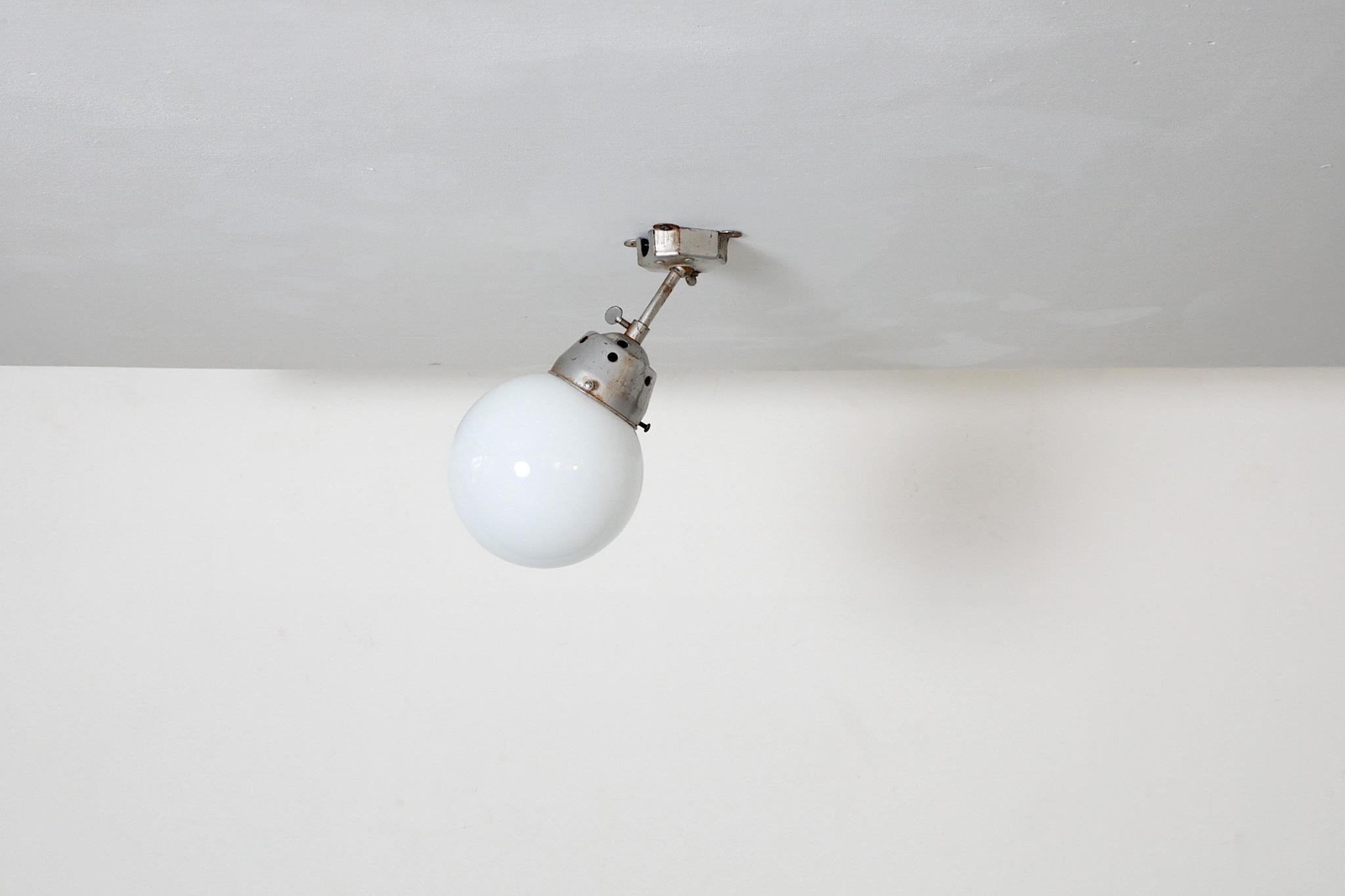 Vintage Industrial Opaline Glass Globe Light with Raw Metal Mounting For Sale 2