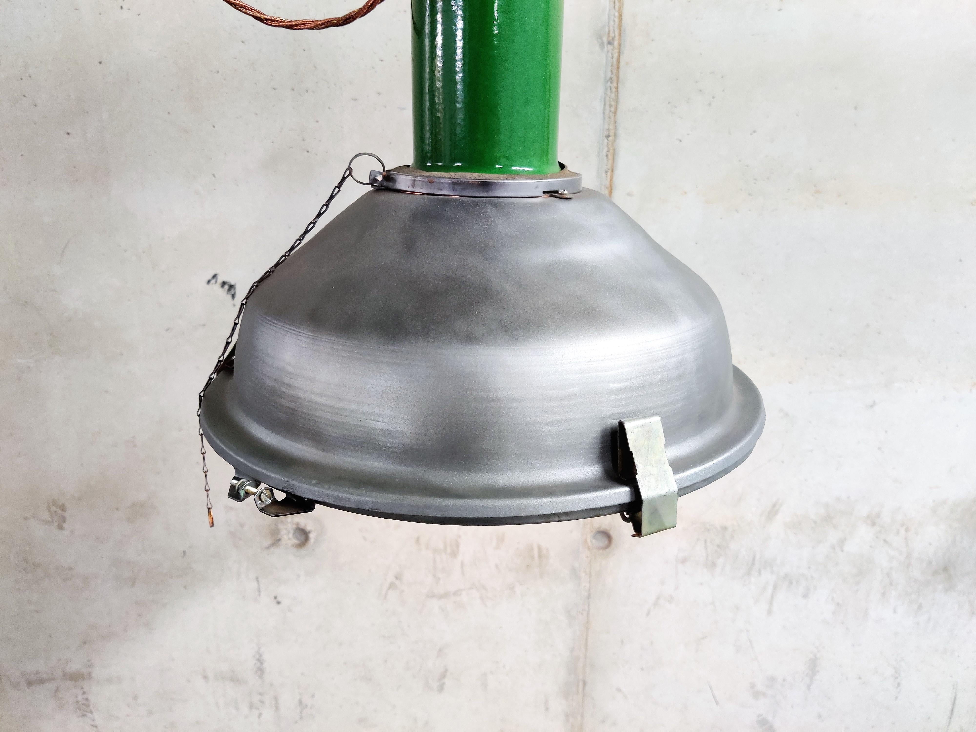 Vintage industrial pendant lights salvaged from an old warehouse in Russia.

These lamps are in a beautiful used condition and have their original glass.

Polished metal shades.

The industrial lamps look stunning in a bar, restaurant, shop or