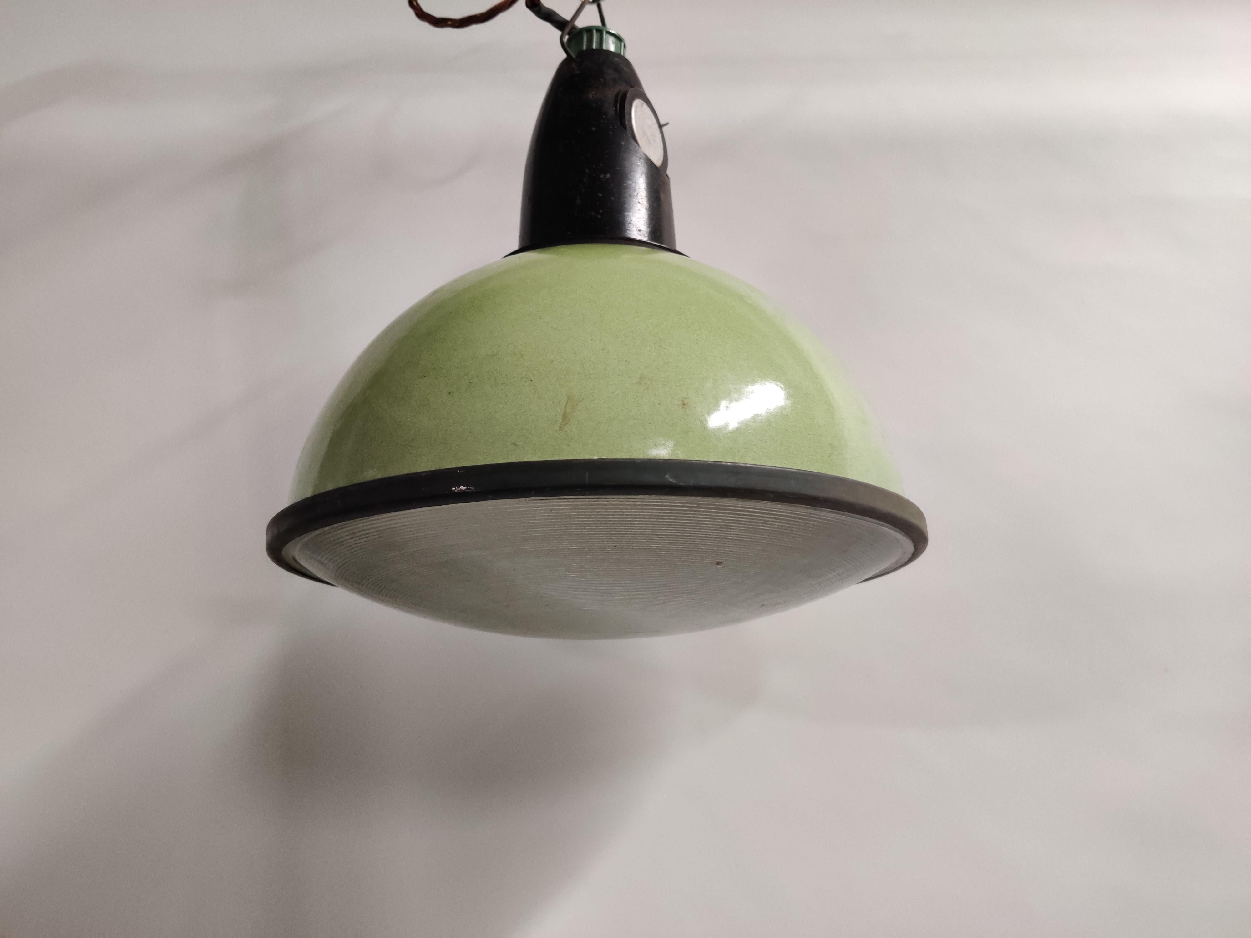 Vintage green enamel pendant lights with glass produced and used in the former USSR factories.

These mint green examples are in very good condition and come with a bakelite shade holder.

This type of lamps looks great in restaurants, bars,