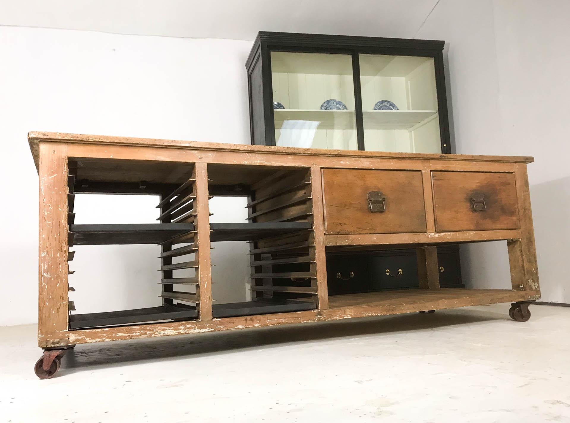 An original early 20th century pine baker's table sourced, along with a pine display cabinet, from a family run bakery on West Street, Camarthen in South Wales. The top is made from sycamore, the most practical and preferred wood of choice by