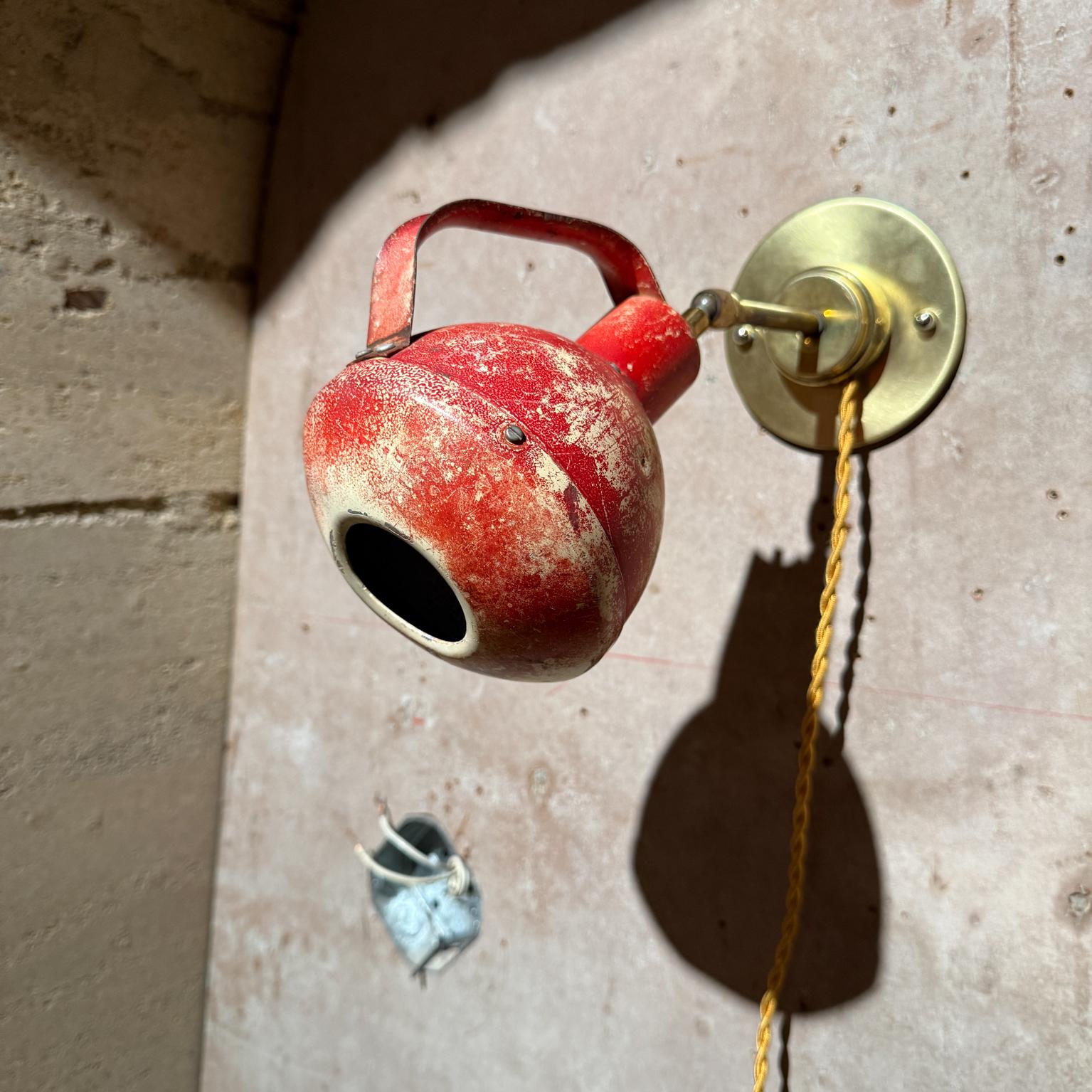 For your consideration, an industrial red wall lamp. Made in the USA circa the 1960s. 
Original red pair.  Retrofitted to meet current US standards with a 4 1/2