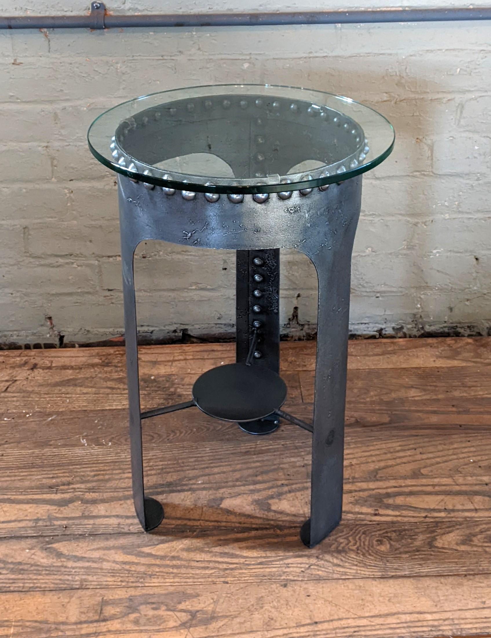 Steel Riveted end table 

Built from Vintage Riveted Steel Water Tanks

Overall Dimensions: 12