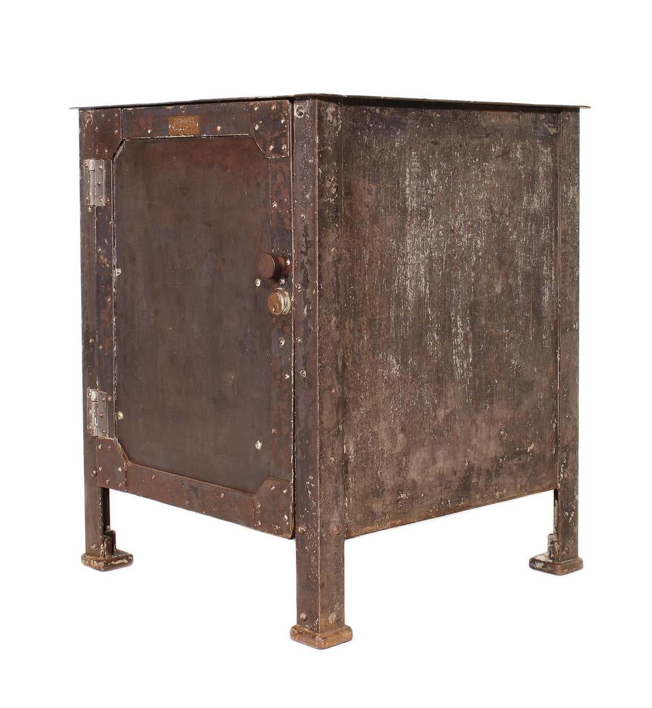 Authentic vintage steel riveted cabinet made by Textile Machine Works in Reading, PA. 

Overall Dimensions: 25 1/8