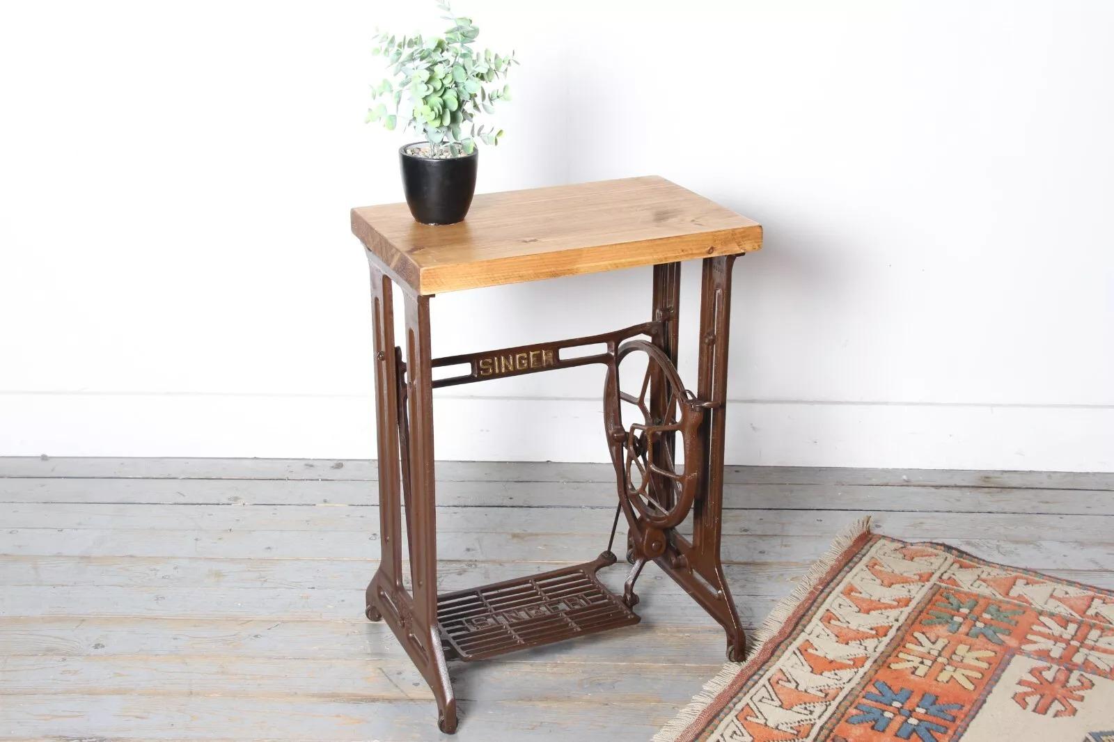 Vintage Industrial Side Table

This striking side table features a reclaimed wooden top that has been waxed and polished for a high-end finish. The top is set on an original mid century steel frame with an original Singer treadle and flywheel,