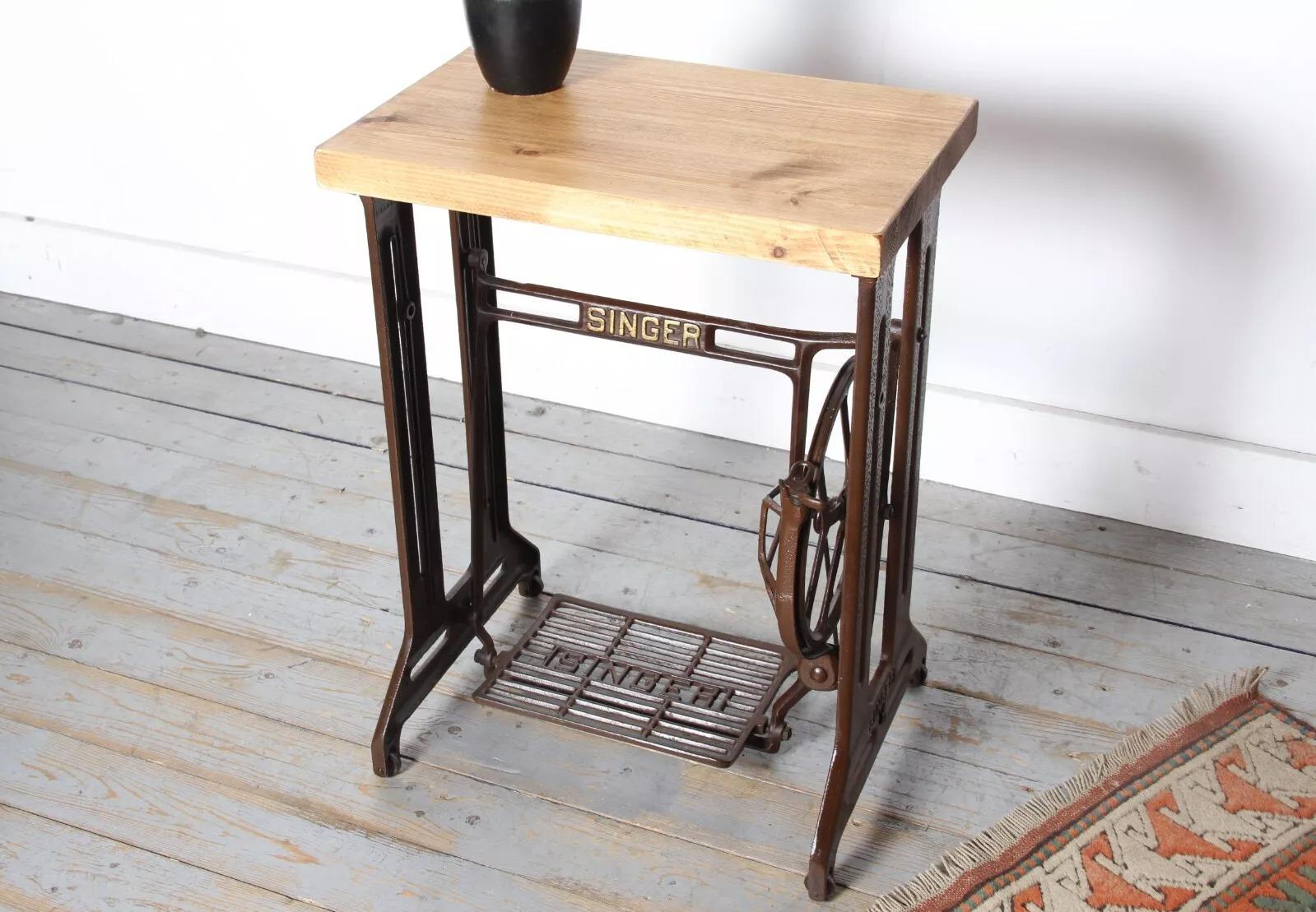 Vintage Industrial Side Table

This striking side table features a reclaimed wooden top that has been waxed and polished for a high-end finish. The top is set on an original mid century steel frame with an original Singer treadle and flywheel,