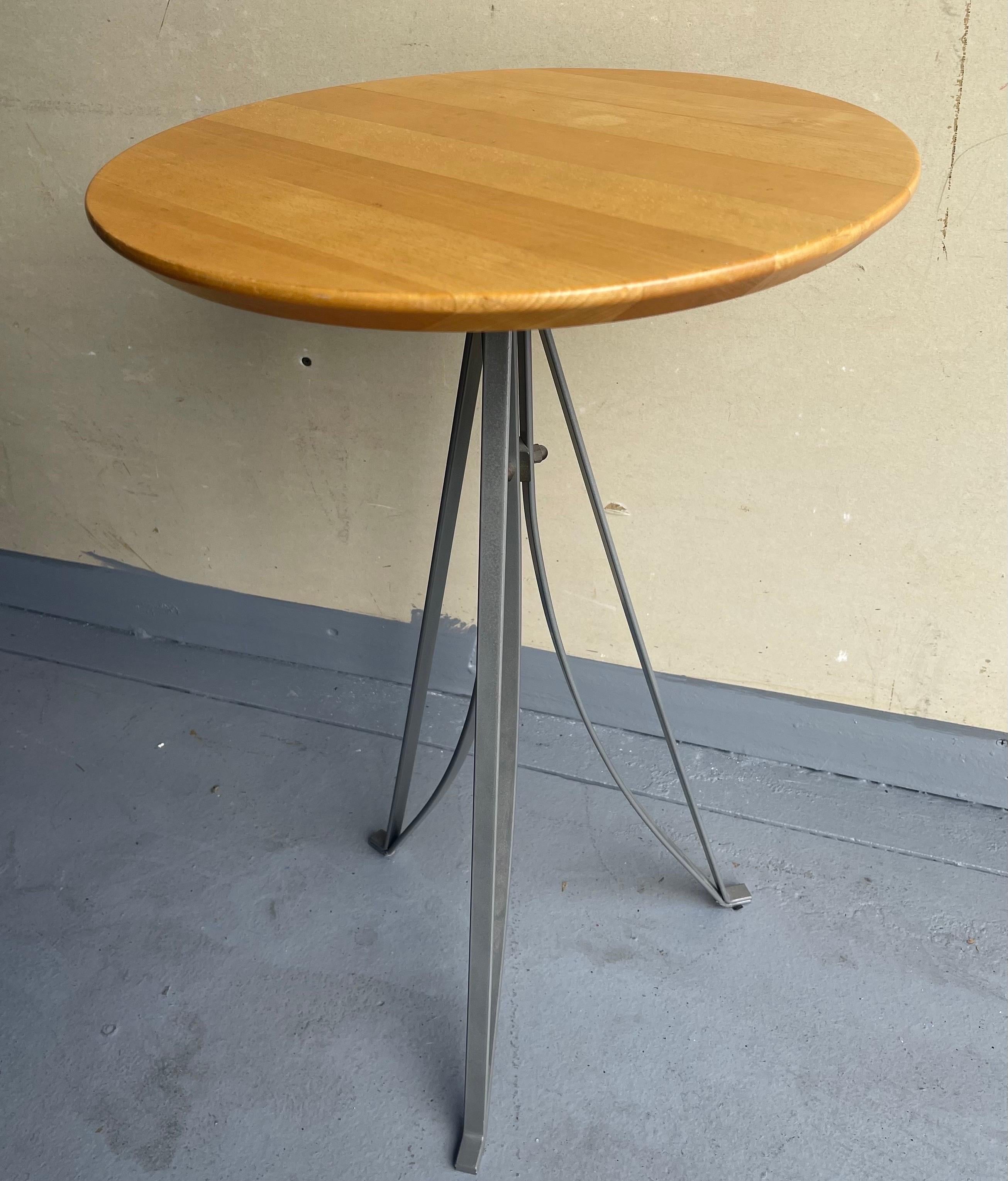 A very cool vintage Industrial side table with maple top and steel legs, circa 1980s. The table is in very good vintage condition and measures 24