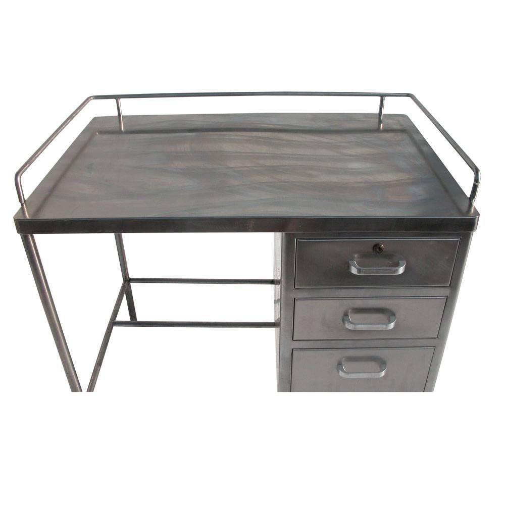 Vintage Industrial 3 feet. Stainless steel desk.
S BLICKMAN Inc.
Stainless steel.
Rail on desk top.
Three drawers.

Measures: 3