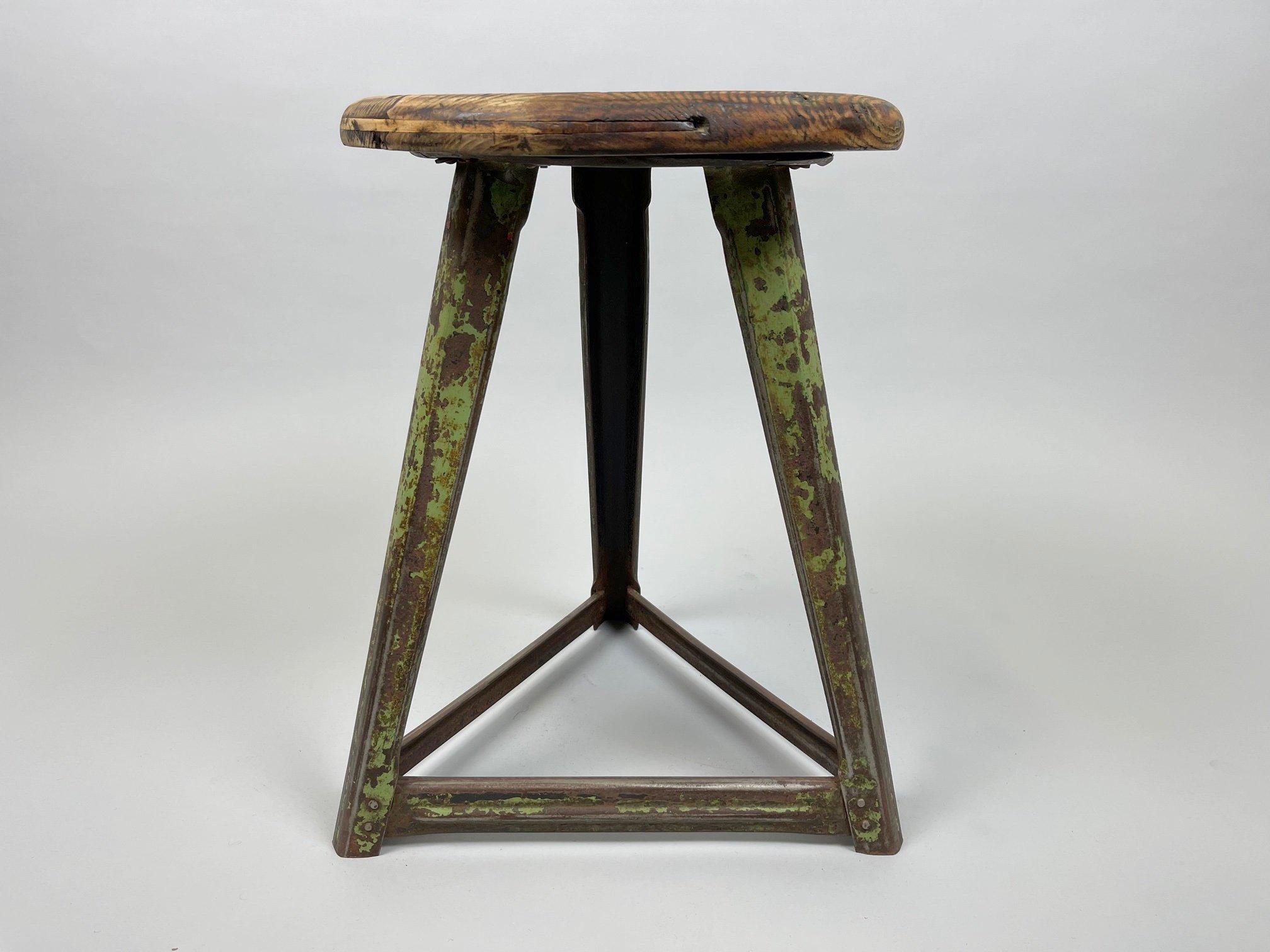 Vintage industrial stool made of steel and wood. Saved from a factory in former Czechoslovakia.