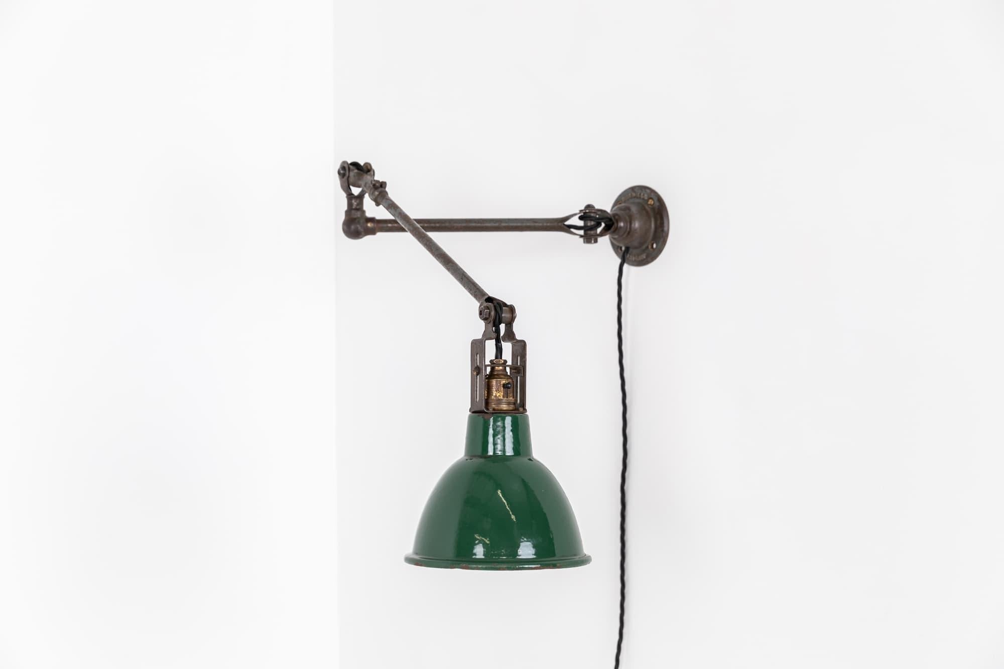 Beautifully engineered workman's lamp designed by renowned lighting manufactures Dugdills. c.1930

In un-touched, original condition - the lamp retains its factory paint throughout and even the matchstick bulbholder. Great articulating motion makes