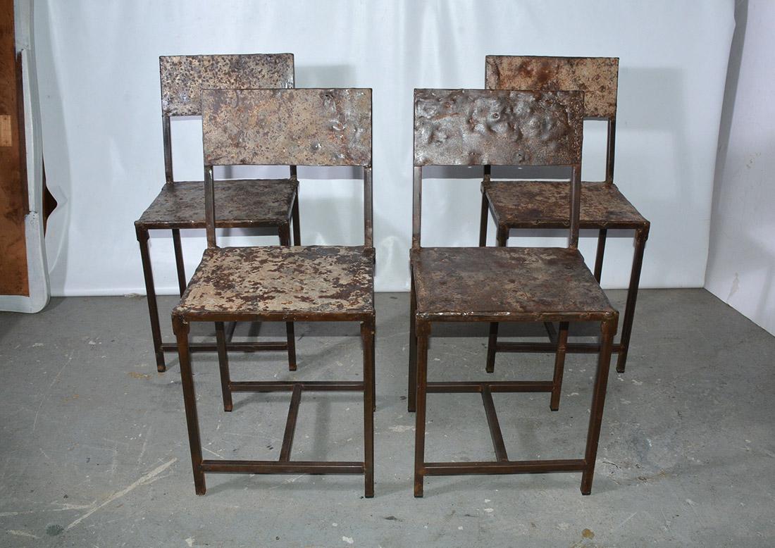 Machine shop style, industrial metal dining chairs, in original condition. Seat and backs were hand pressed in huge Industrial presses before being hand welded together. These chairs are a good practical scale as a dining chair for regular use.  