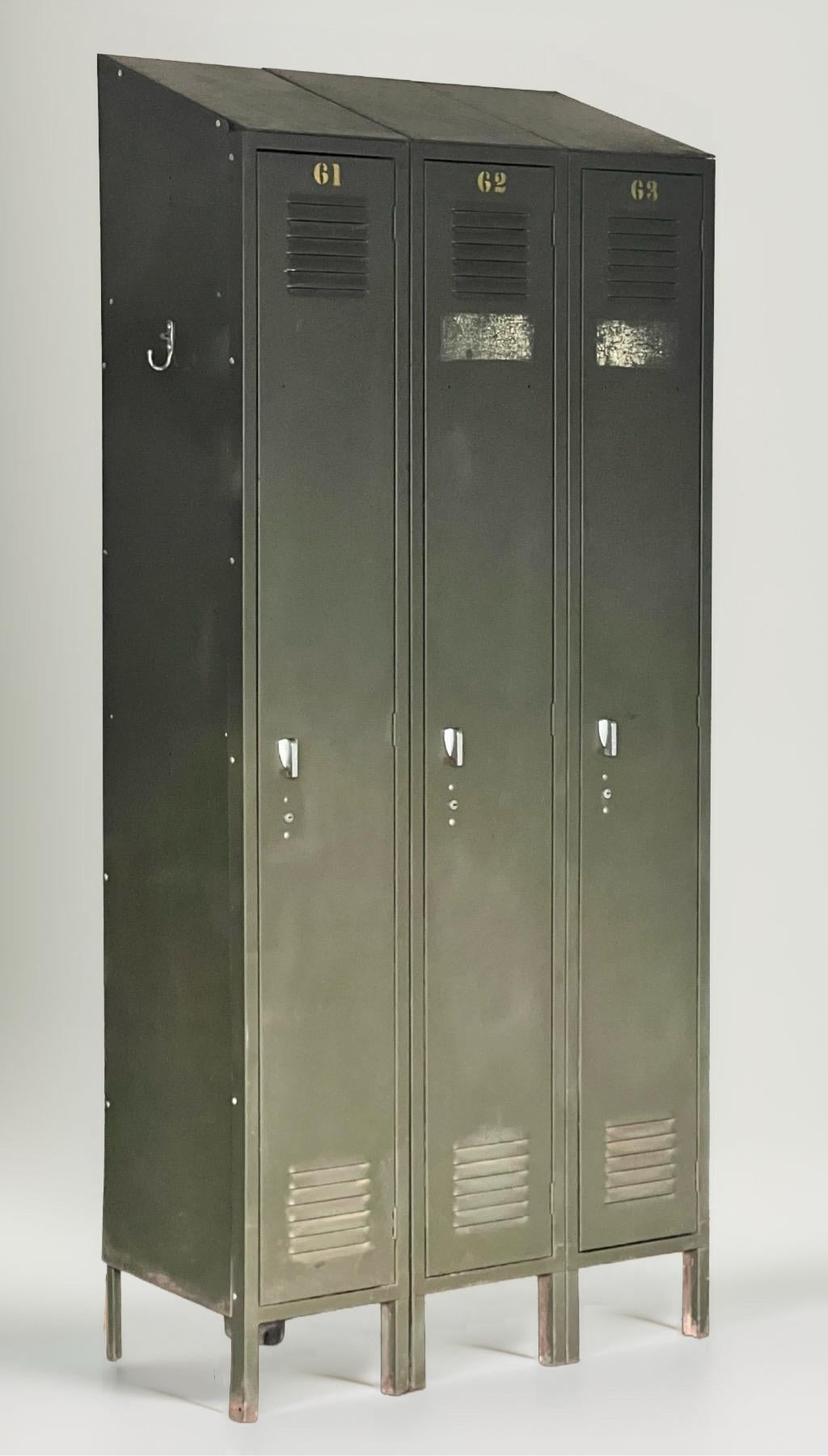Slope top steel industrial army green locker by Lyon Metal, c. 1950s.

A single freestanding unit of three lockers made of heavy gauge enameled steel by America's leading manufacturer of industrial steel storage products since 1901. Each one
