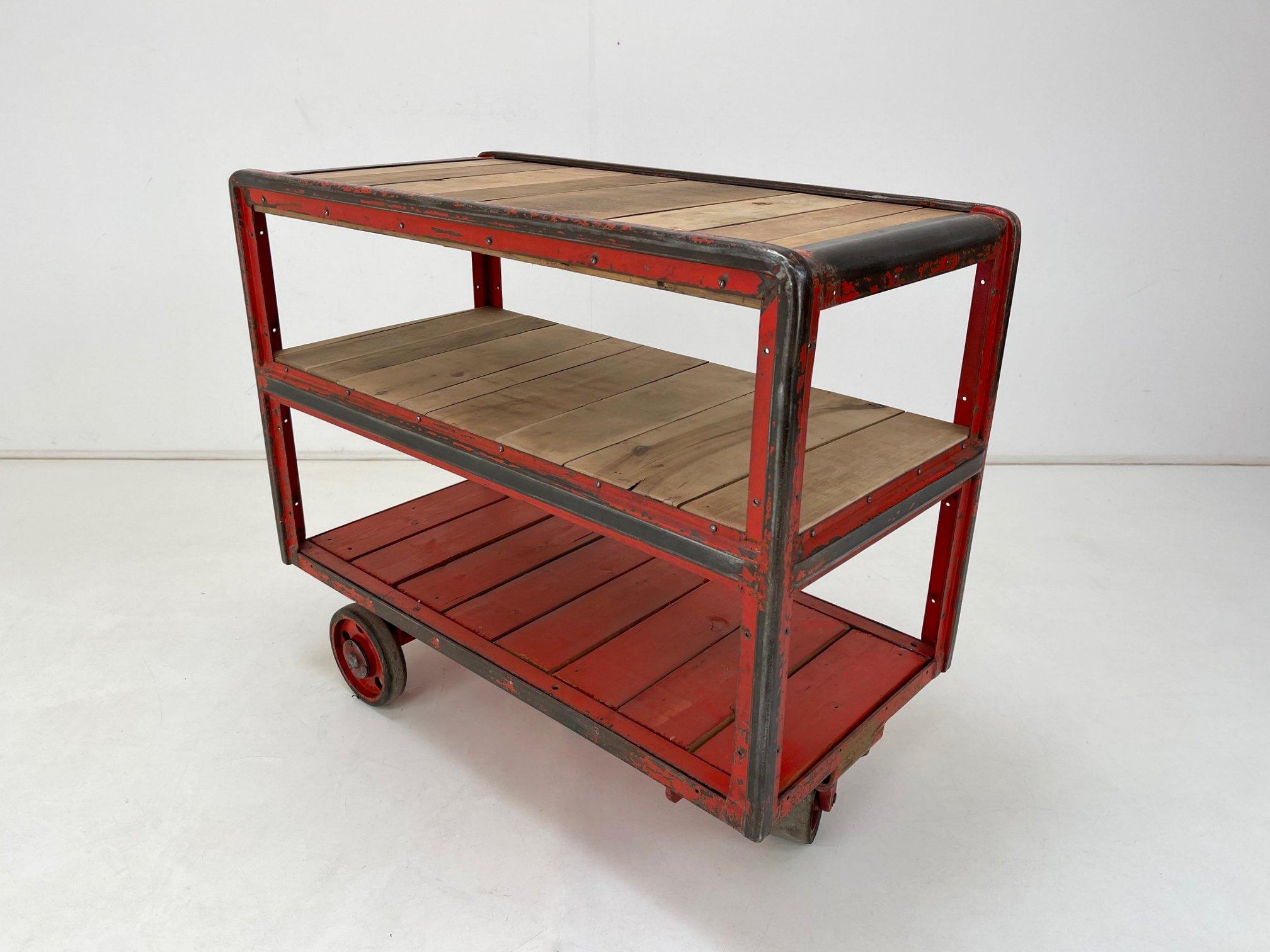 Beautiful vintage industrial cart with original red paint from an old factory in Czechoslovakia. All parts are original. The wooden parts were sanded.