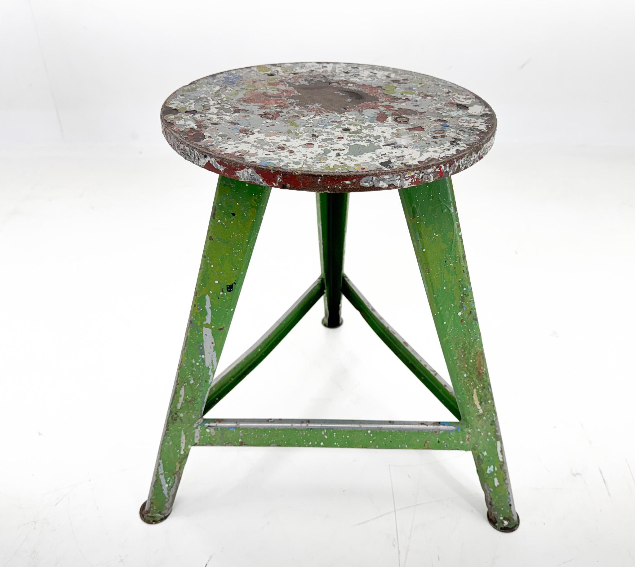 Vintage industrial tripod stool, made of steel and wood. Saved from a factory in former Czechoslovakia. The diameter of the seat is 31 cm. The widest point at the bottom of the legs is 47 cm. 