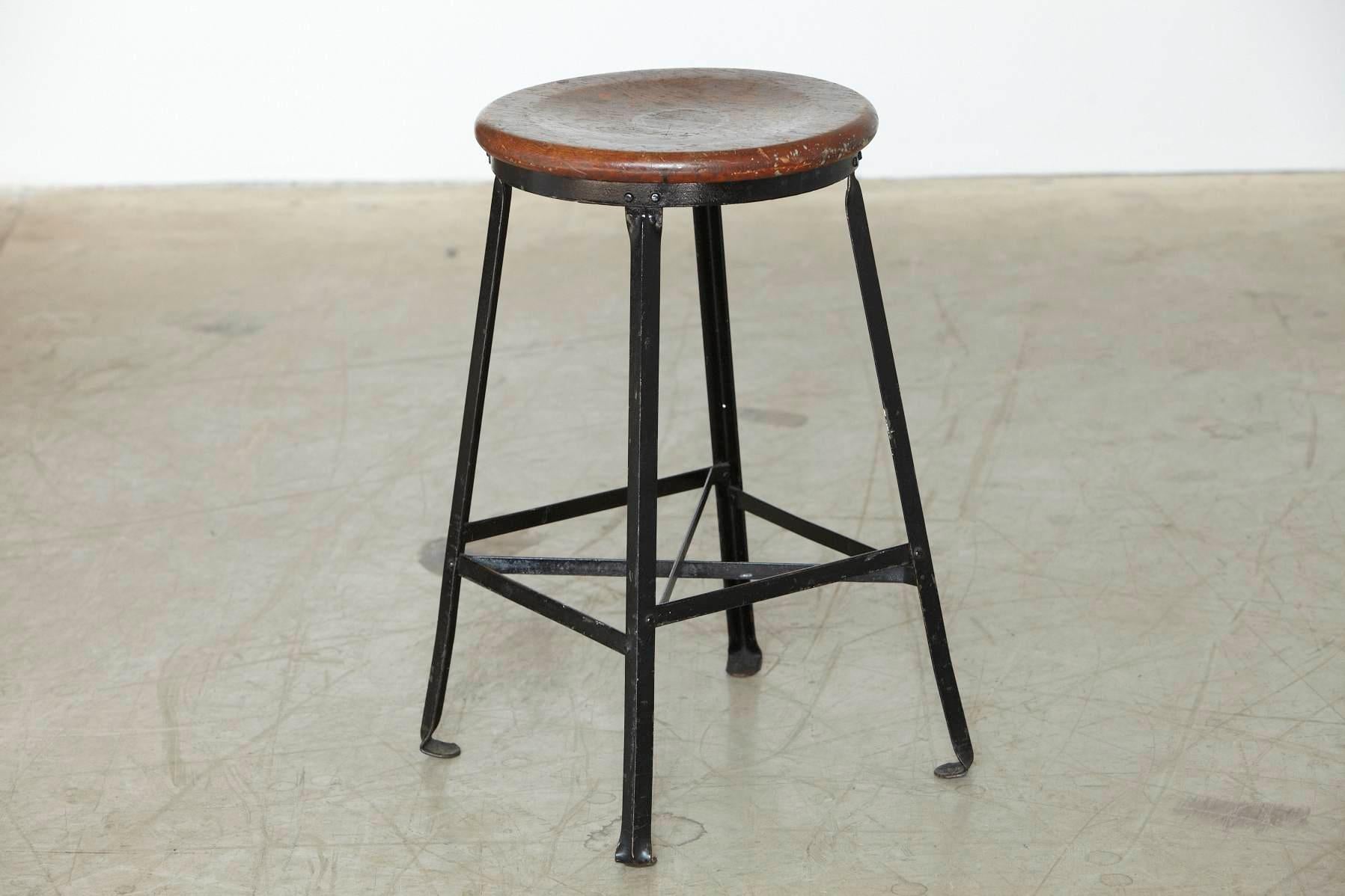 Great looking black painted industrial stool with steel frame and round oak seat in it's original condition with nice patina, circa 1940s.
Strong and solid construction.
Measurements: W 15.5 x D 15.5 x H 24.75 - seat diameter 14, all inches.