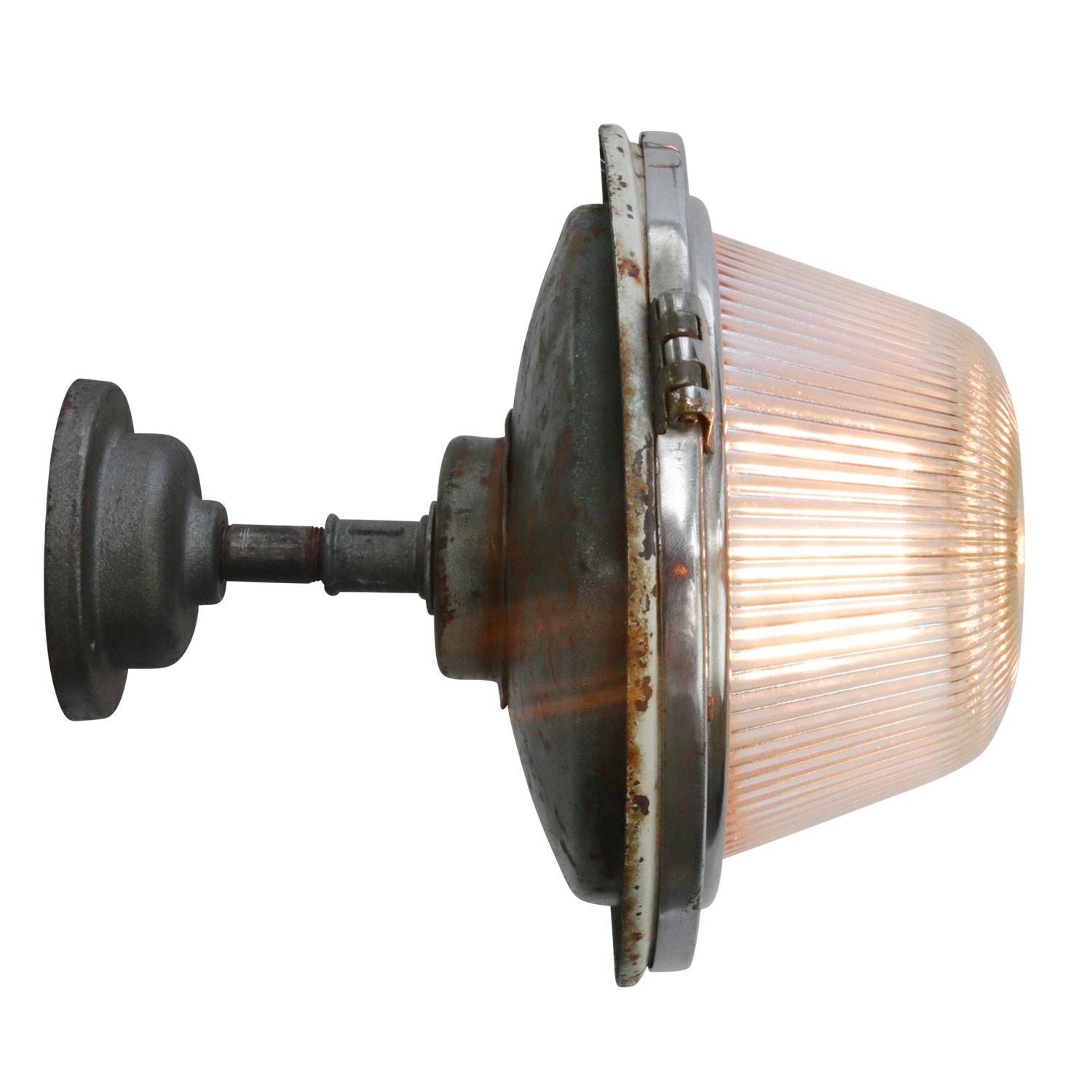 Holophane glass wall light
Clear striped glass shade
cast iron wall mount diameter 10 cm
wall lamp / ceiling scone

Weight: 2.70 kg / 6 lb

Priced per individual item. All lamps have been made suitable by international standards for