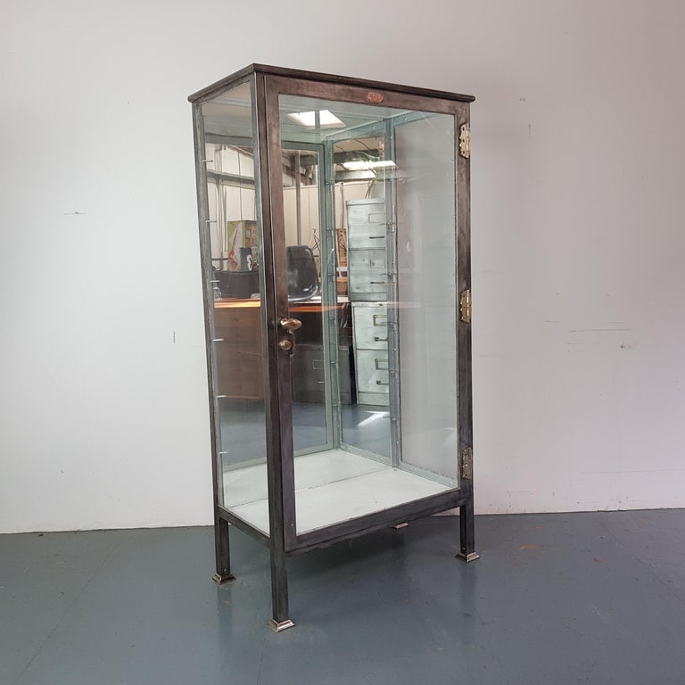 Vintage Industrial Stripped and Polished Steel Glazed Medicine For Sale at 1stDibs