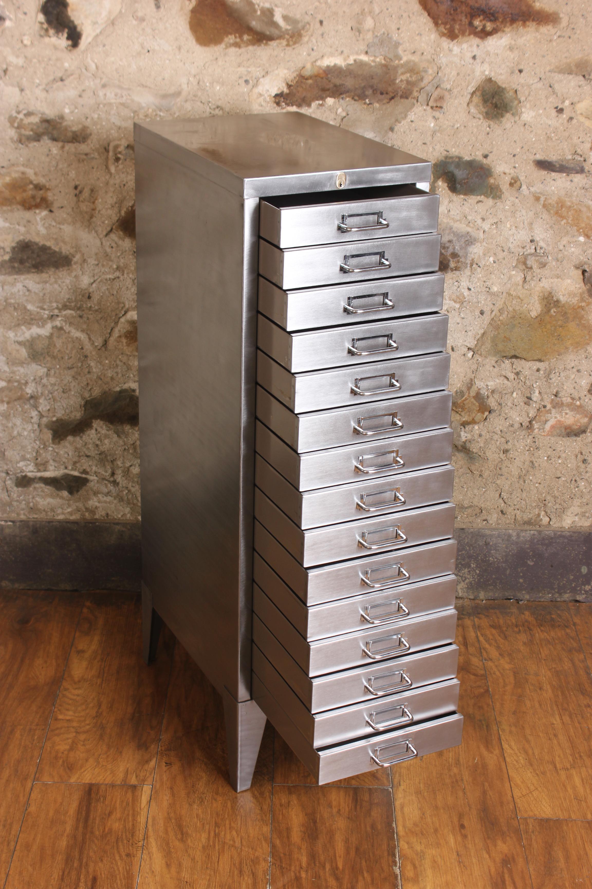 A stunning vintage 1950s industrial stripped metal 15-drawer filing cabinet complete with key. This impressive A4 size industrial design piece has been stripped back to bare metal and was manufactured in the United Kingdom by Stor All Steel during
